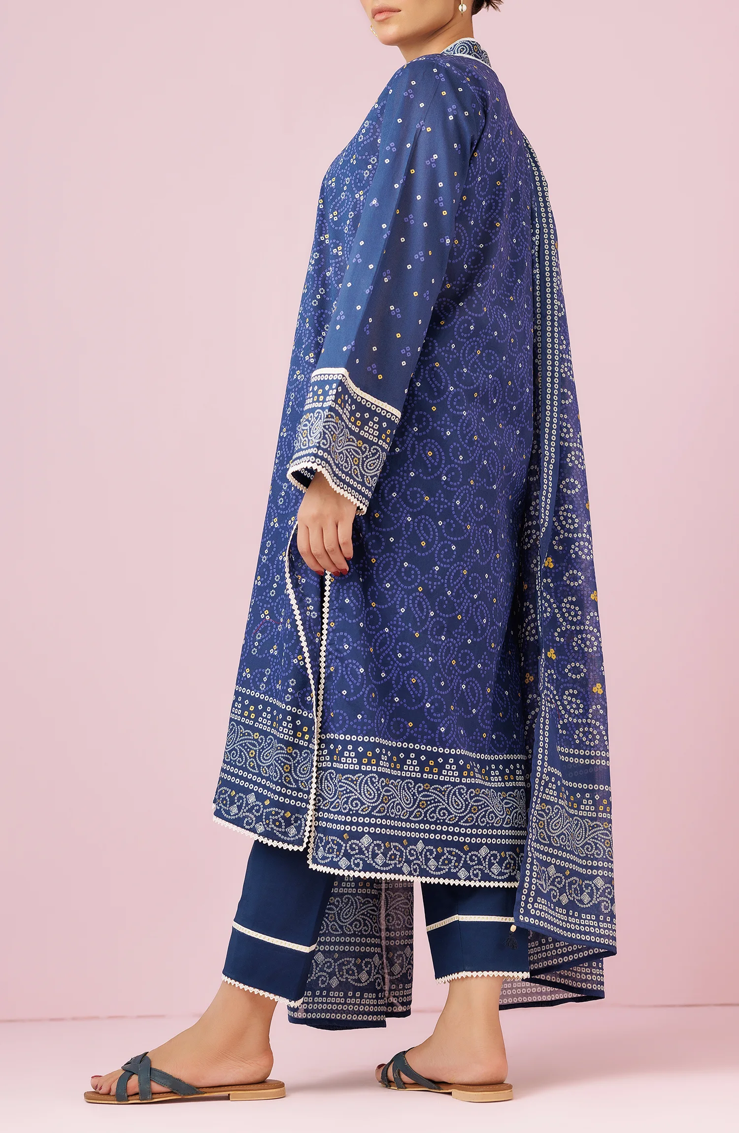 Woman wearing a blue patterned outfit with a matching dupatta on a traditional blue trouser. Unstitched Printed Lawn Shirt Dupatta & Pant - 3 Piece Suits - OTL-20105
