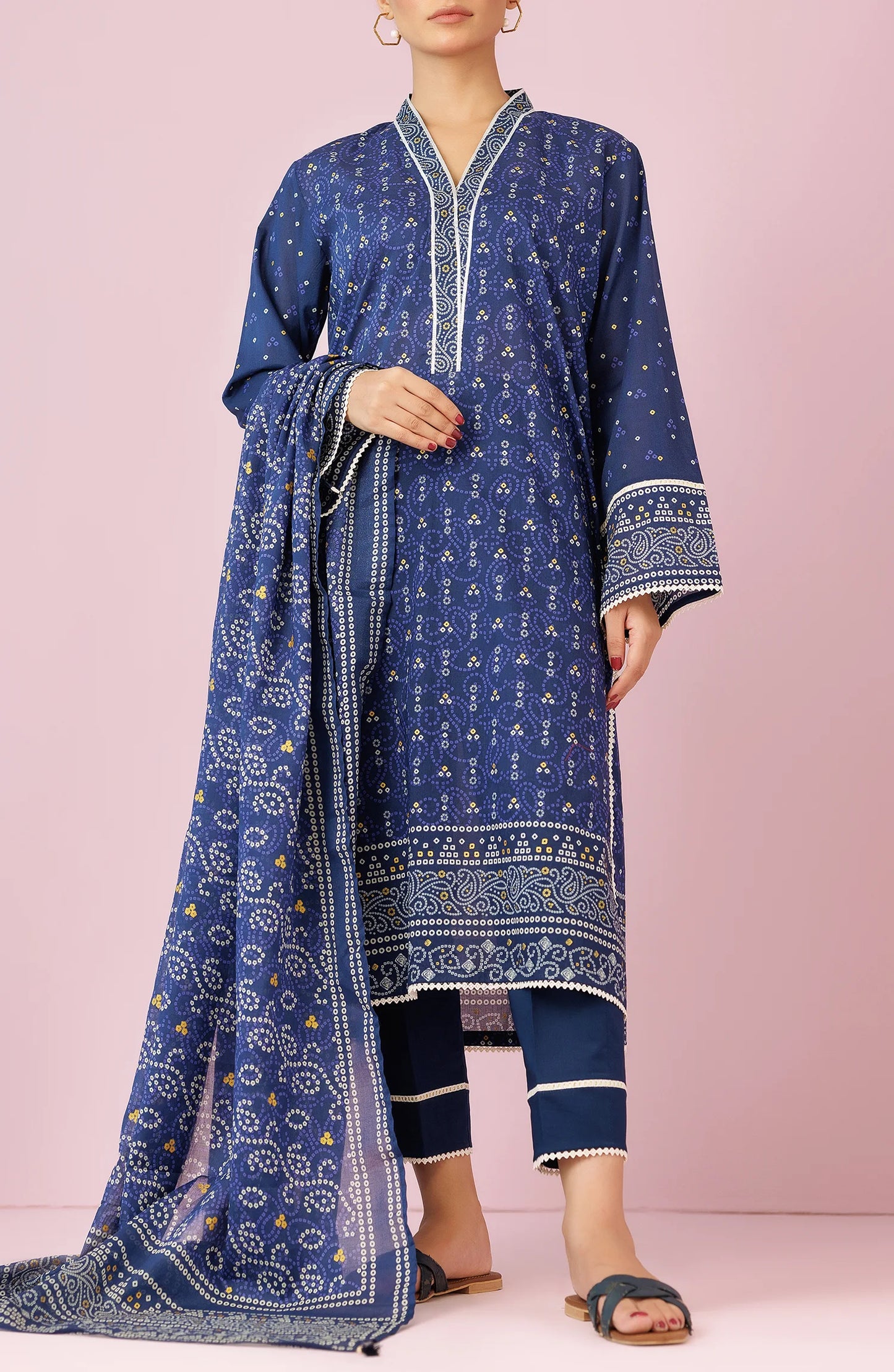 Woman wearing a blue patterned outfit with a matching dupatta on a traditional blue trouser. Unstitched Printed Lawn Shirt Dupatta & Pant - 3 Piece Suits - OTL-20105