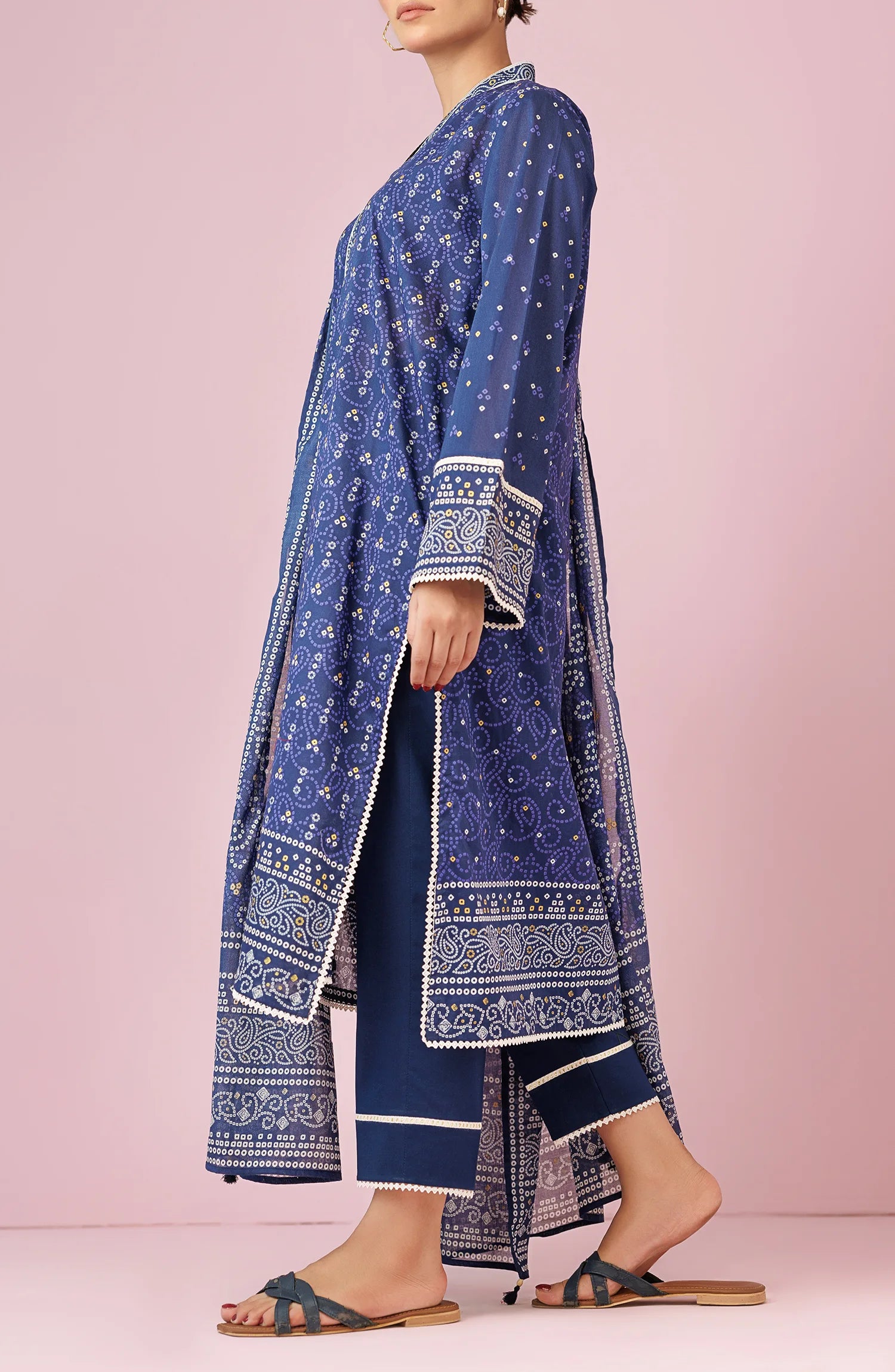Woman wearing a blue patterned outfit with a matching dupatta on a traditional blue trouser. Unstitched Printed Lawn Shirt Dupatta & Pant - 3 Piece Suits - OTL-20105