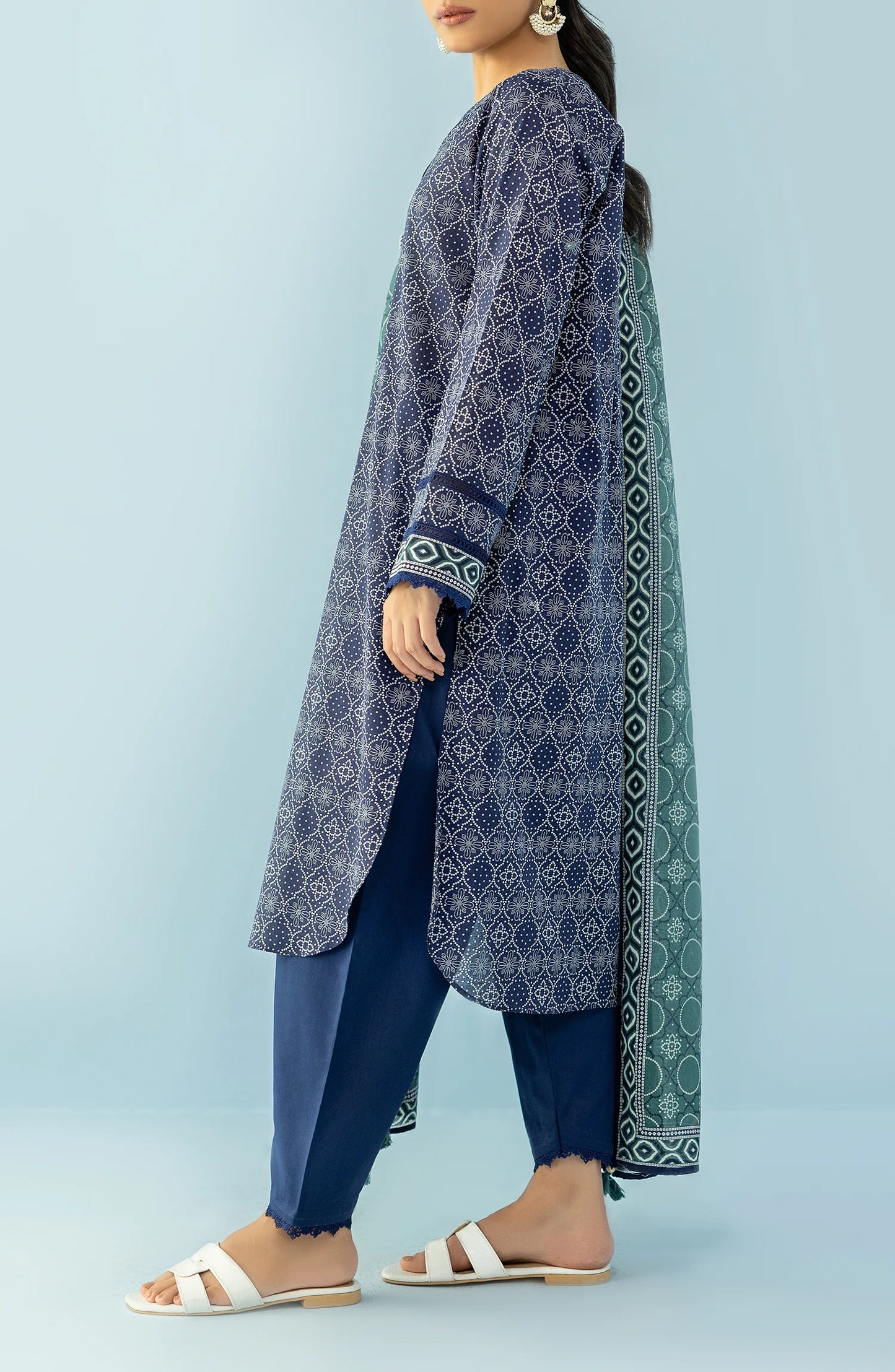 Woman wearing a navy blue patterned kurta with blue pants and a green dupatta on a blue trouser. Unstitched Printed Lawn Shirt Dupatta & Pant - 3 Piece Suits - OTL-20125