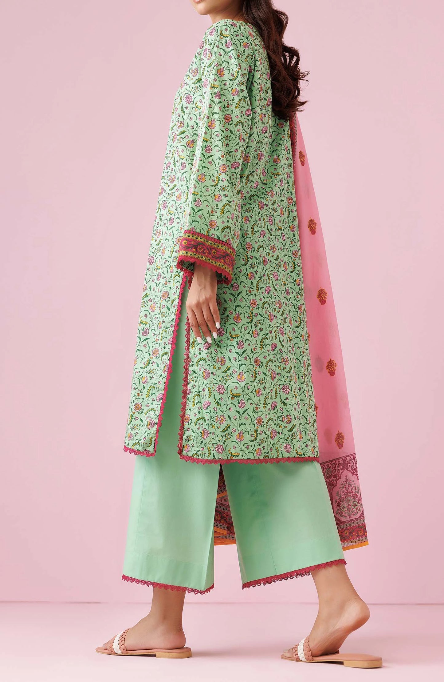 Woman wearing a green floral kurta with light green pants and a pink dupatta on a dyed trouser. Unstitched Printed Lawn Shirt Dupatta & Pant - 3 Piece Suits - OTL-20135