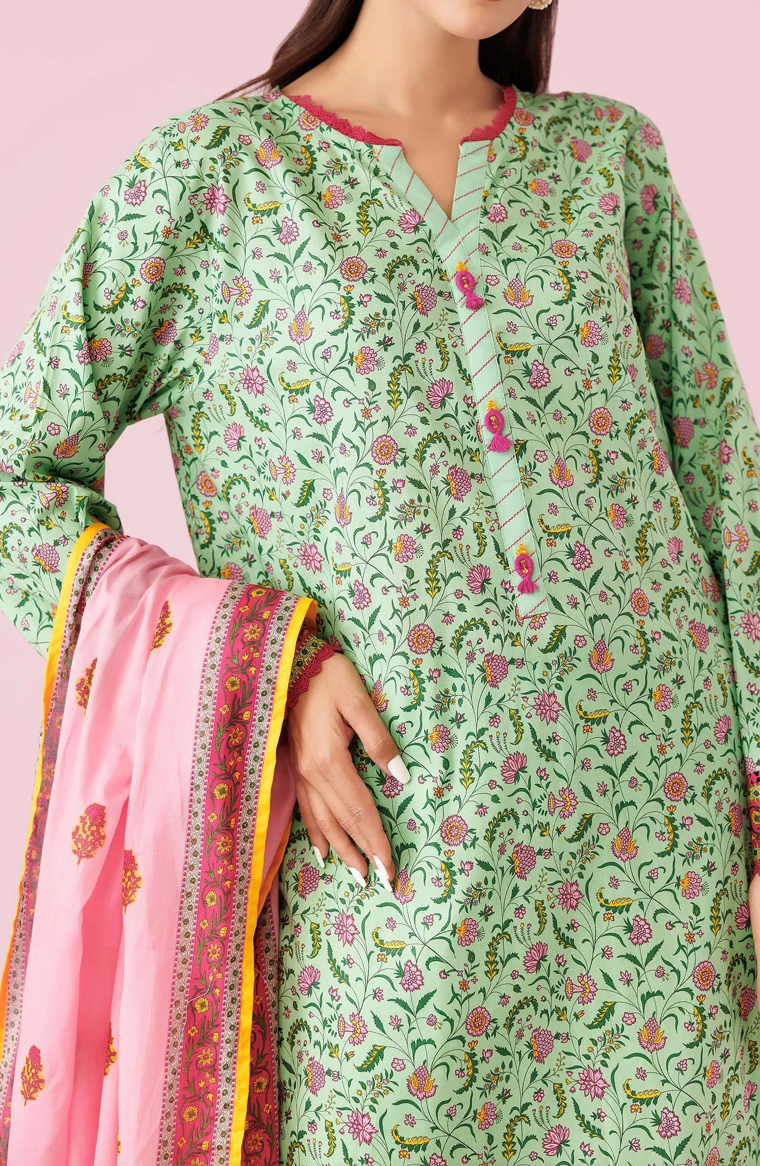 Woman wearing a green floral kurta with light green pants and a pink dupatta on a dyed trouser. Unstitched Printed Lawn Shirt Dupatta & Pant - 3 Piece Suits - OTL-20135