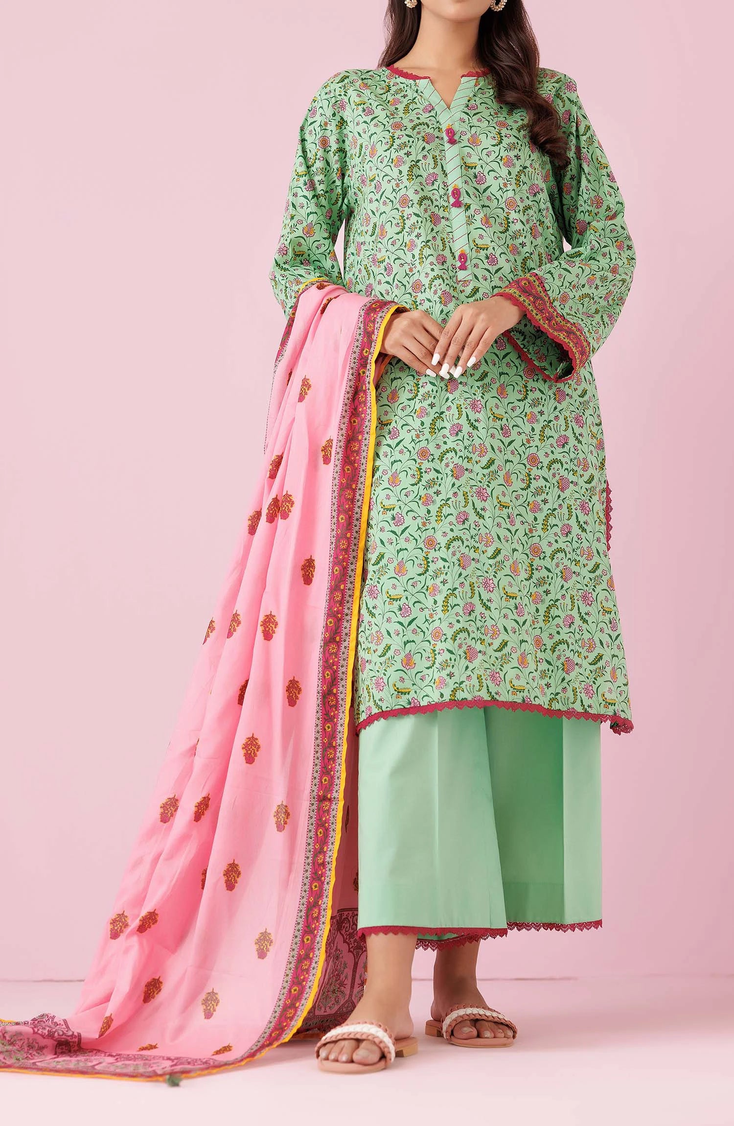Woman wearing a green floral kurta with light green pants and a pink dupatta on a dyed trouser. Unstitched Printed Lawn Shirt Dupatta & Pant - 3 Piece Suits - OTL-20135