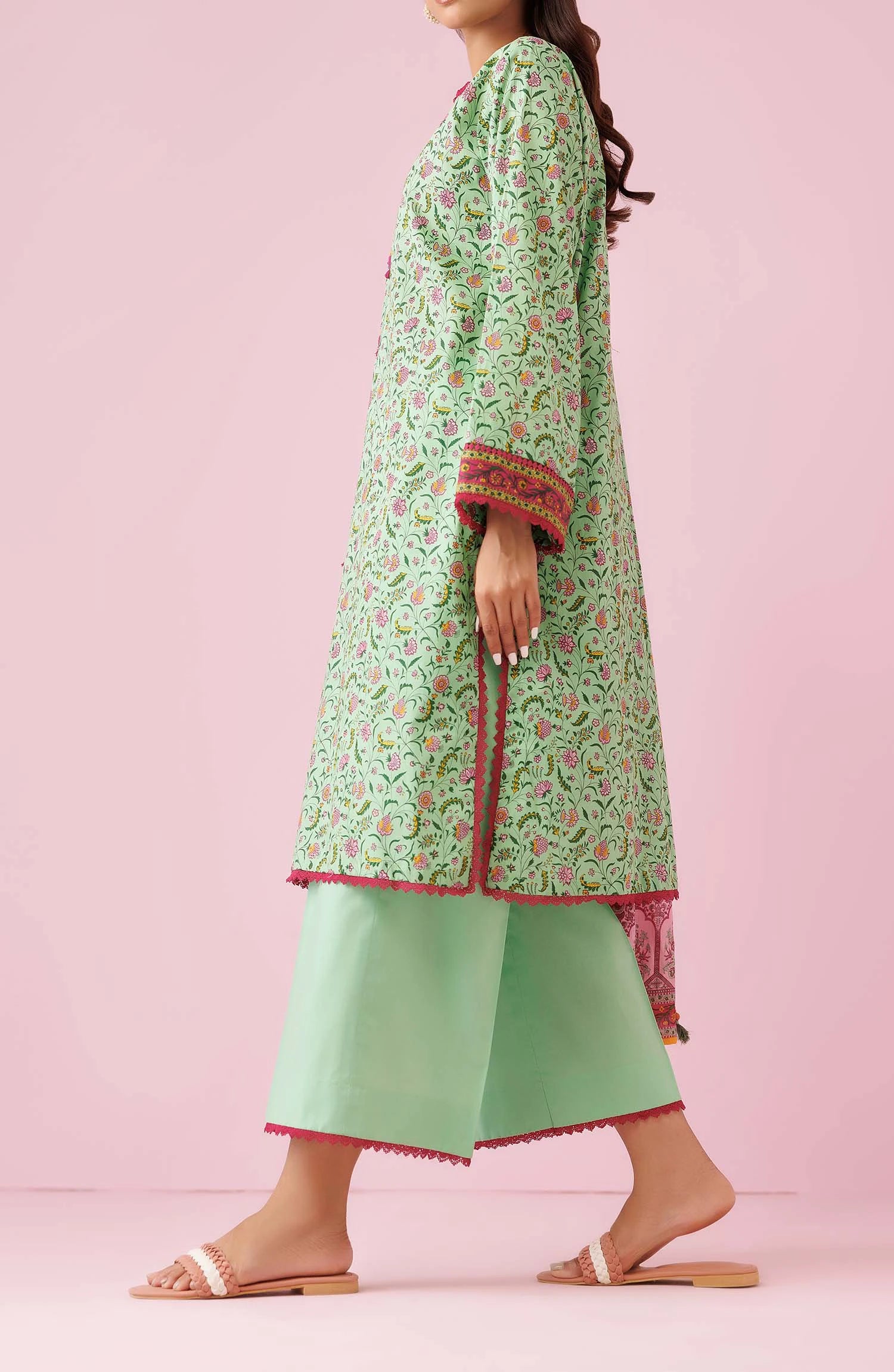 Woman wearing a green floral kurta with light green pants and a pink dupatta on a dyed trouser. Unstitched Printed Lawn Shirt Dupatta & Pant - 3 Piece Suits - OTL-20135
