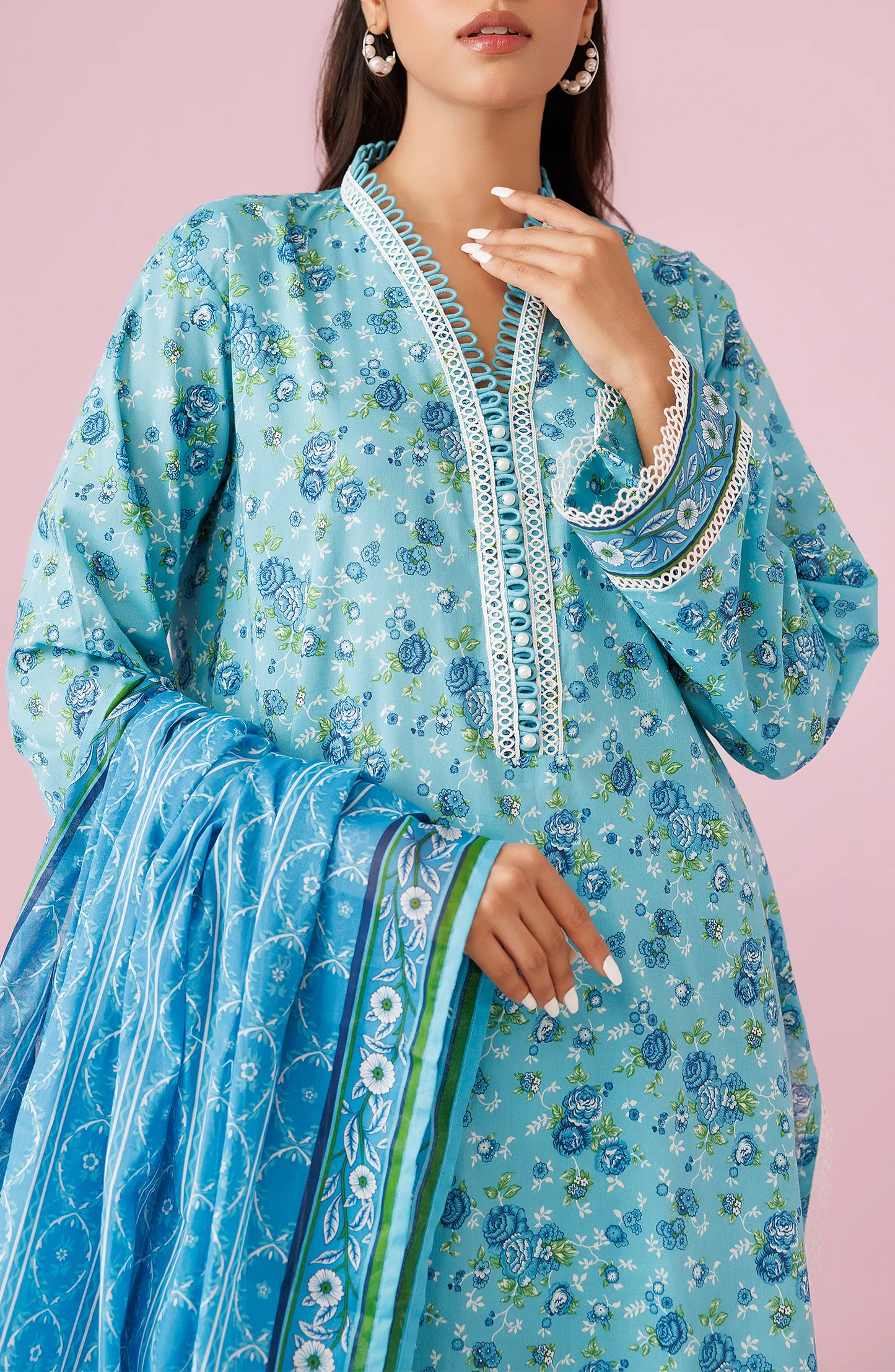 Woman wearing a blue printed outfit with a matching dupatta on a plain trosuer. Unstitched Printed Lawn Shirt Dupatta & Pant - 3 Piece Suits - OTL-20185
