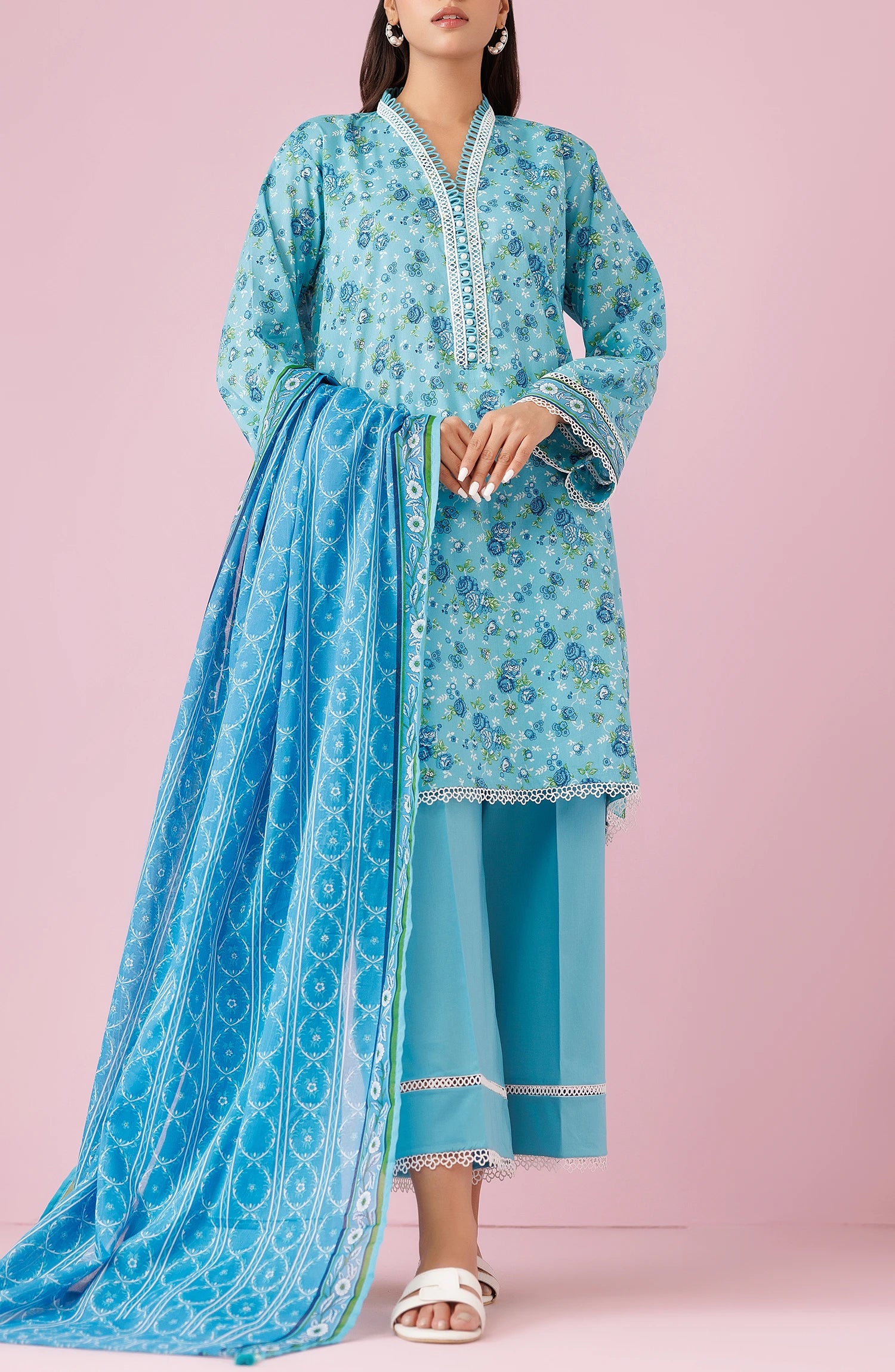 Woman wearing a blue printed outfit with a matching dupatta on a plain trosuer. Unstitched Printed Lawn Shirt Dupatta & Pant - 3 Piece Suits - OTL-20185