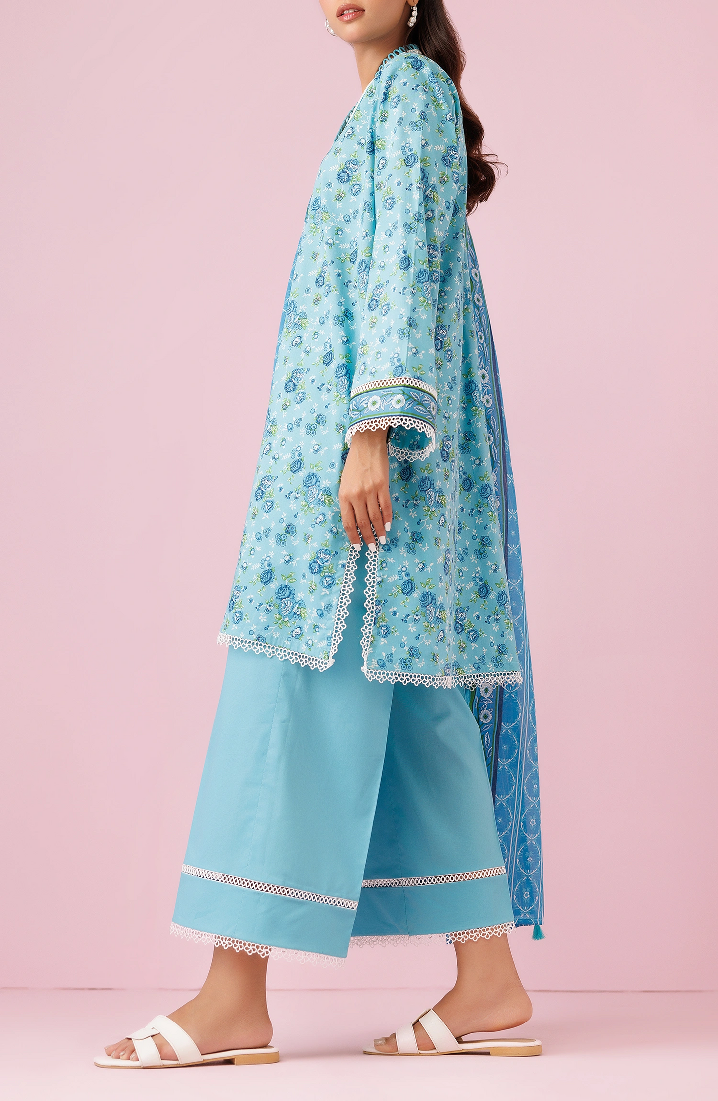 Woman wearing a blue printed outfit with a matching dupatta on a plain trosuer. Unstitched Printed Lawn Shirt Dupatta & Pant - 3 Piece Suits - OTL-20185