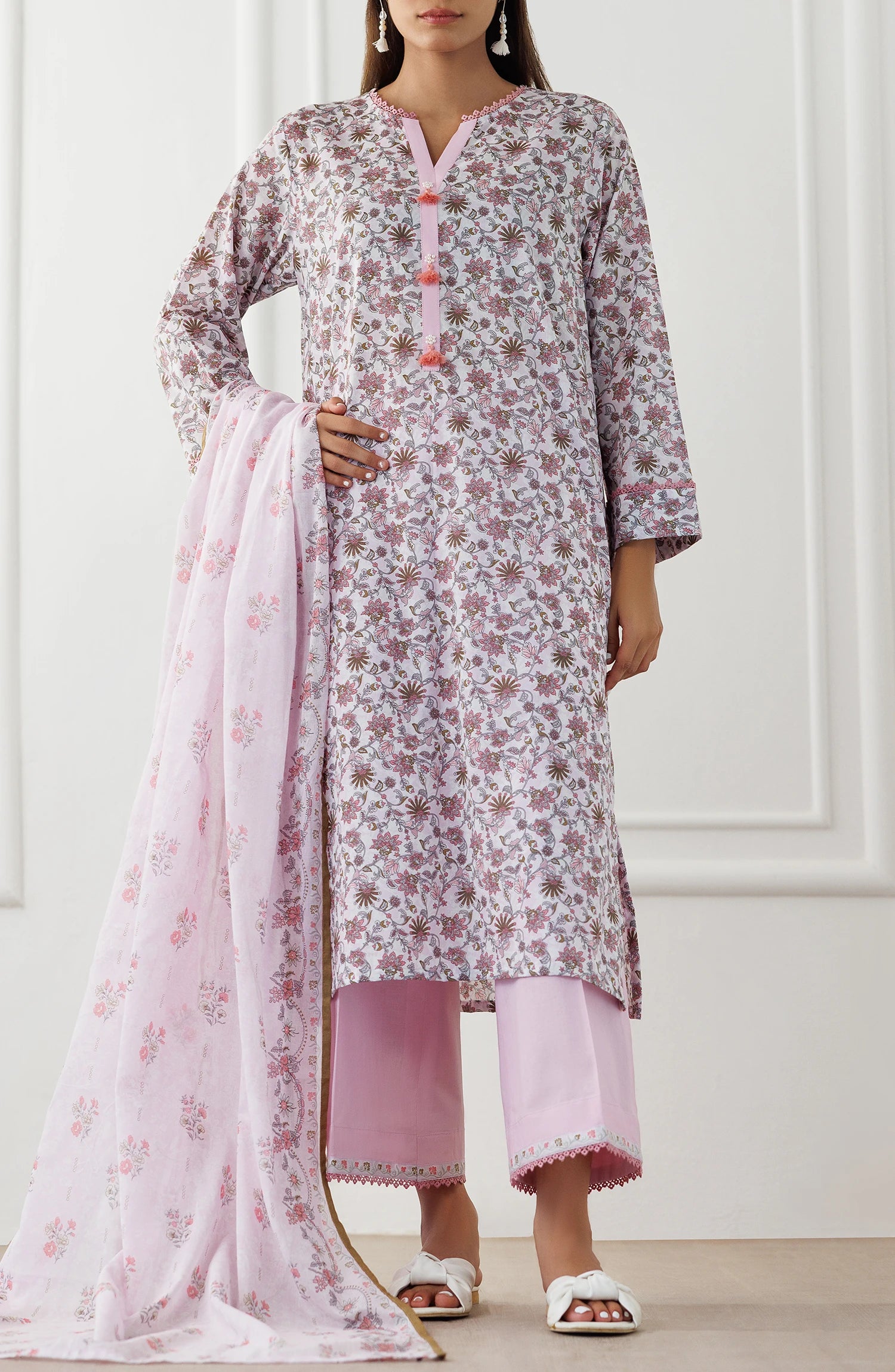 Woman wearing a floral kurta with pink pants and dupatta on a plain trouser. Stitched Printed Lawn Shirt Dupatta & Pant - 3 Piece Suits - OTL-25-021