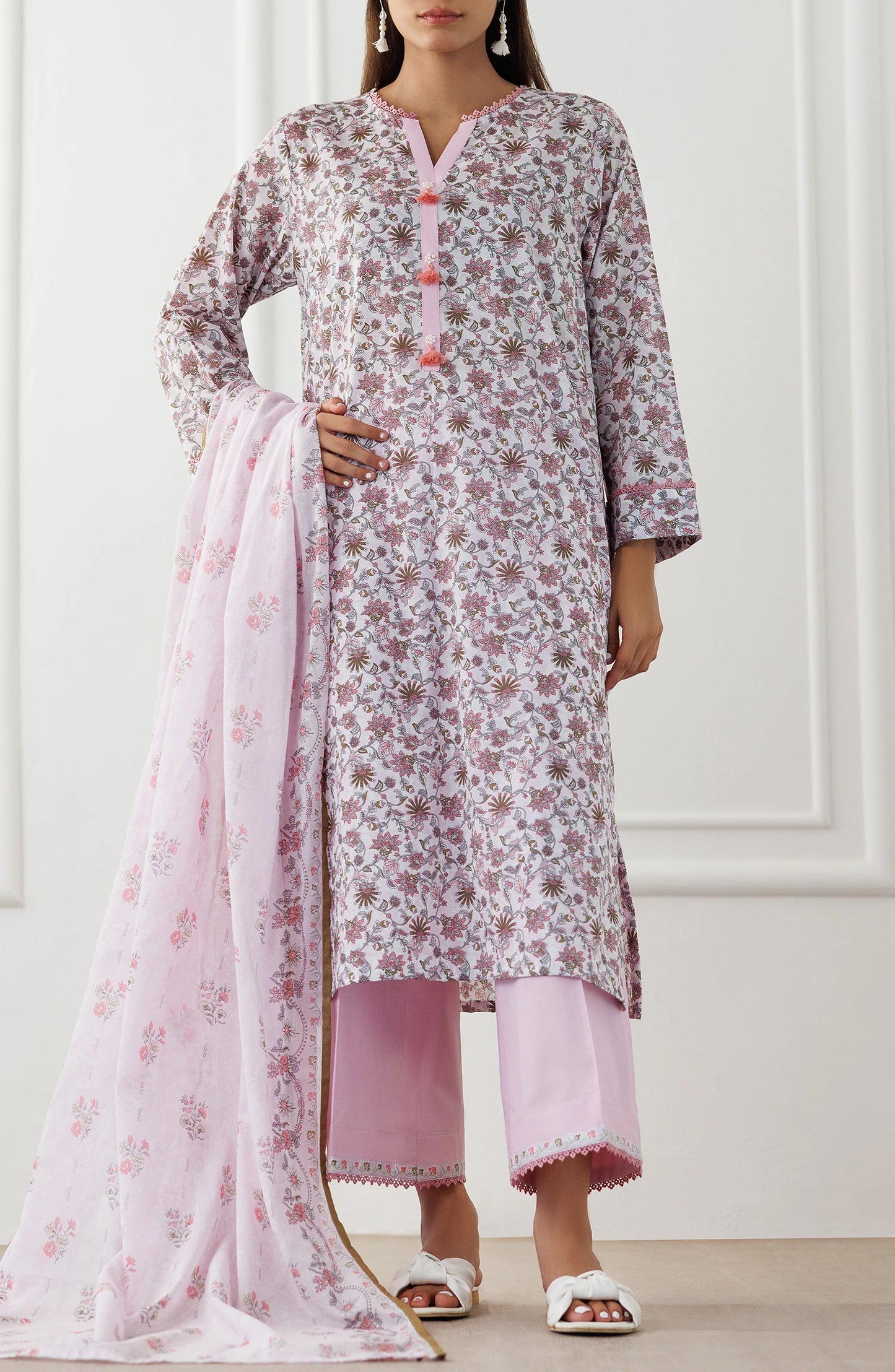 Woman wearing a floral kurta with pink pants and dupatta on a plain trouser. Stitched Printed Lawn Shirt Dupatta & Pant - 3 Piece Suits - OTL-25-021