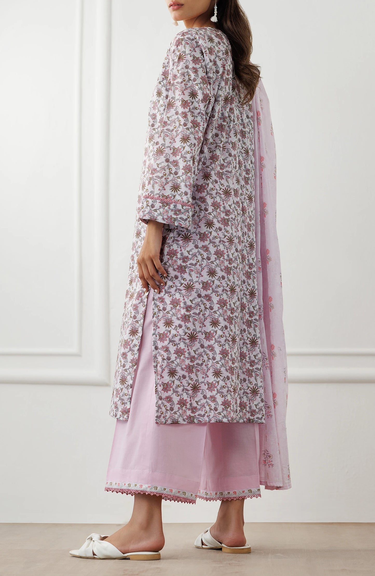 Woman wearing a floral kurta with pink pants and matching dupatta with a traditional shalwar. UNSTITCHED Printed Lawn Shirt Dupatta & Pant - 3 Piece Suits - OTL-25-021