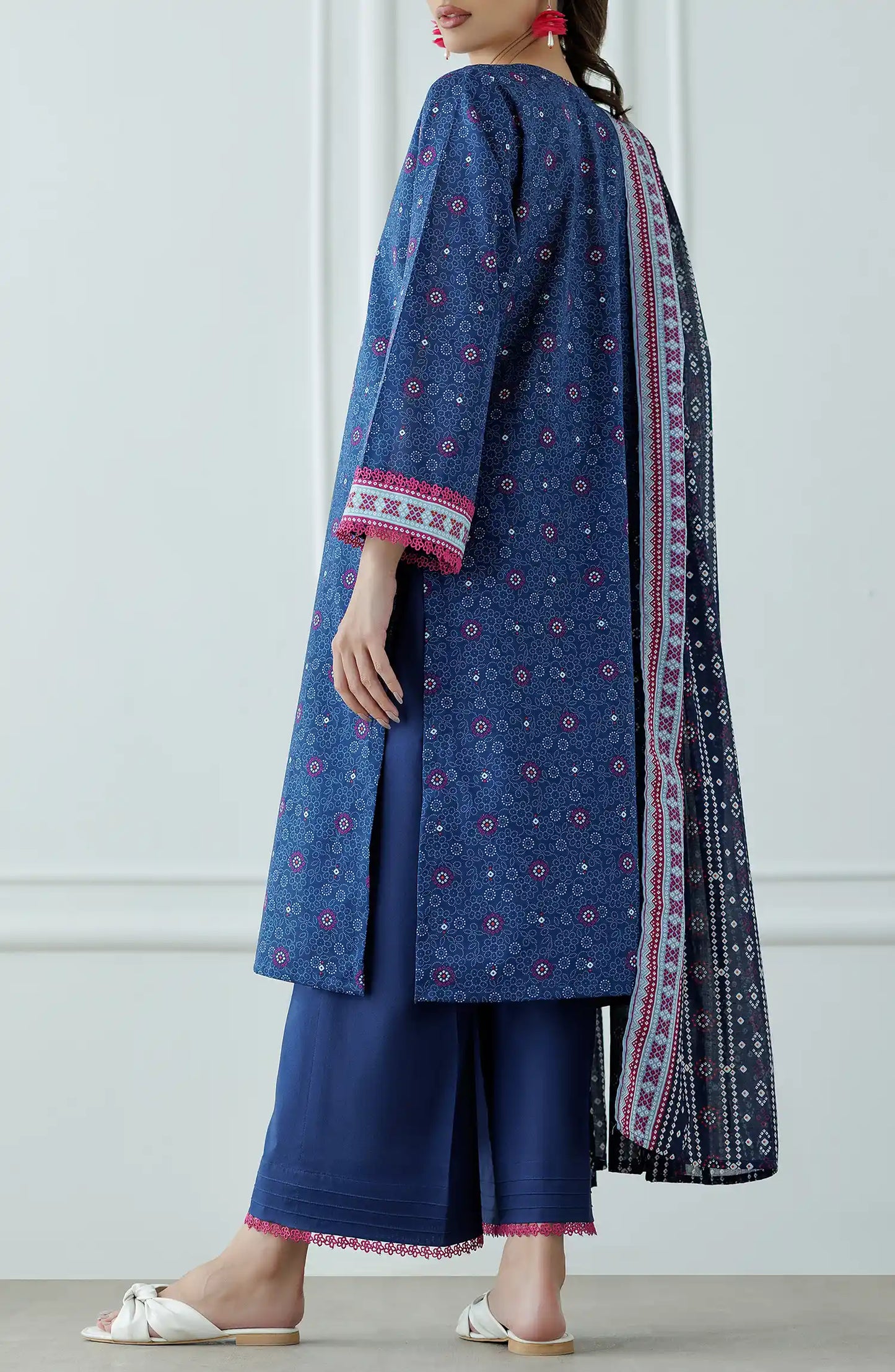 Woman wearing a blue traditional outfit with a matching dupatta against a dyed trouser. Stitched Printed Lawn Shirt Dupatta & Pant - 3 Piece Suits - OTL-25-036