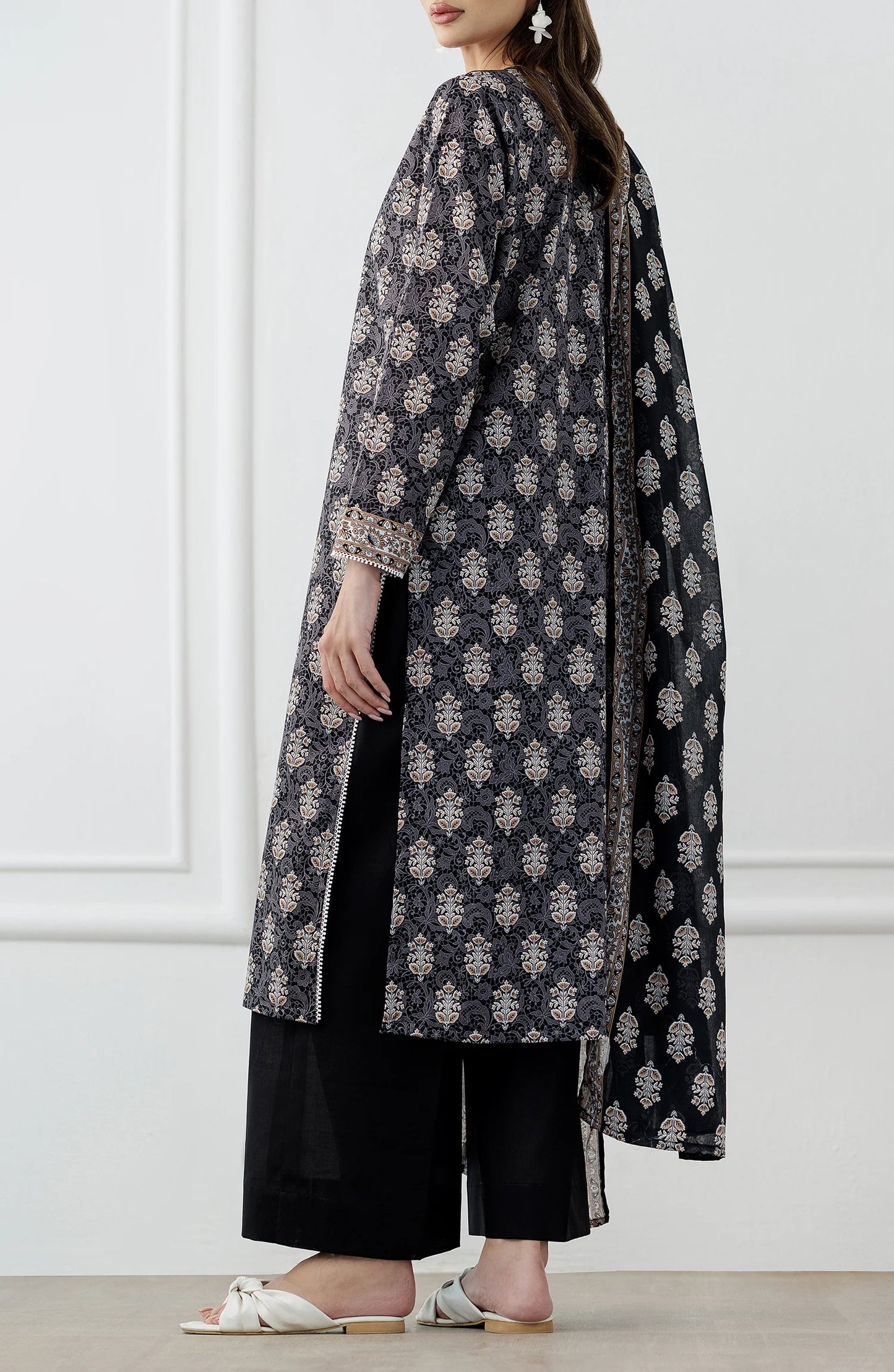 Woman wearing a black and white patterned kurta with a printed dupatta and against a dyed trouser. Stitched Printed Lawn Shirt Dupatta & Pant - 3 Piece Suits - OTL-25-105