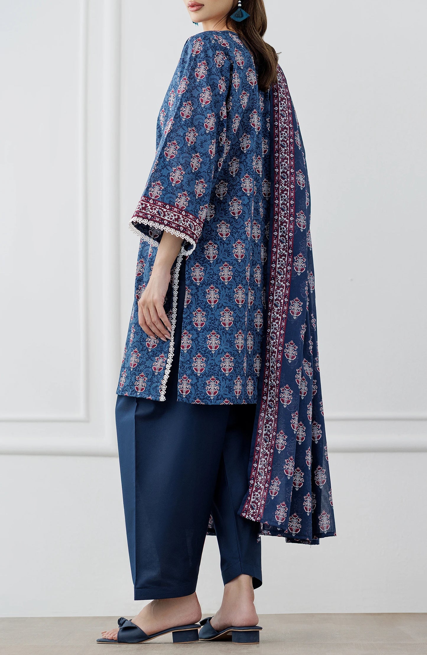 Woman wearing a blue patterned outfit with a matching dupatta on a dyed trouser. Stitched Printed Lawn Shirt Dupatta & Pant - 3 Piece Suits - OTL-25-353