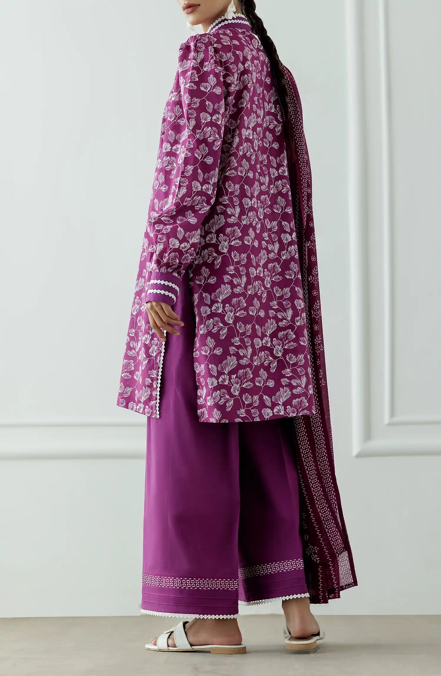 Women wearing a purple dress with white floral pattern and pearl details and dyed trouser. Stitched Printed Lawn Shirt Dupatta & Pant - 3 Piece Suits - OTL-25-378
