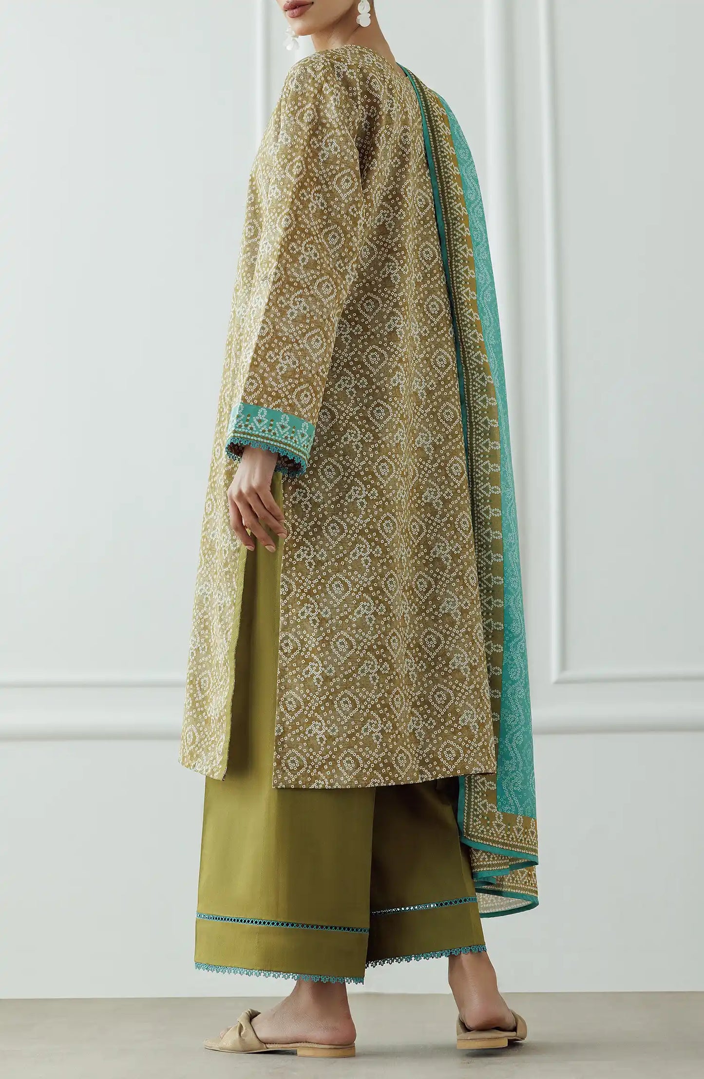 Woman wearing a patterned kurta with green dupatta against a dyed trouser. Stitched Printed Lawn Shirt Dupatta & Pant - 3 Piece Suits - OTL-25-408