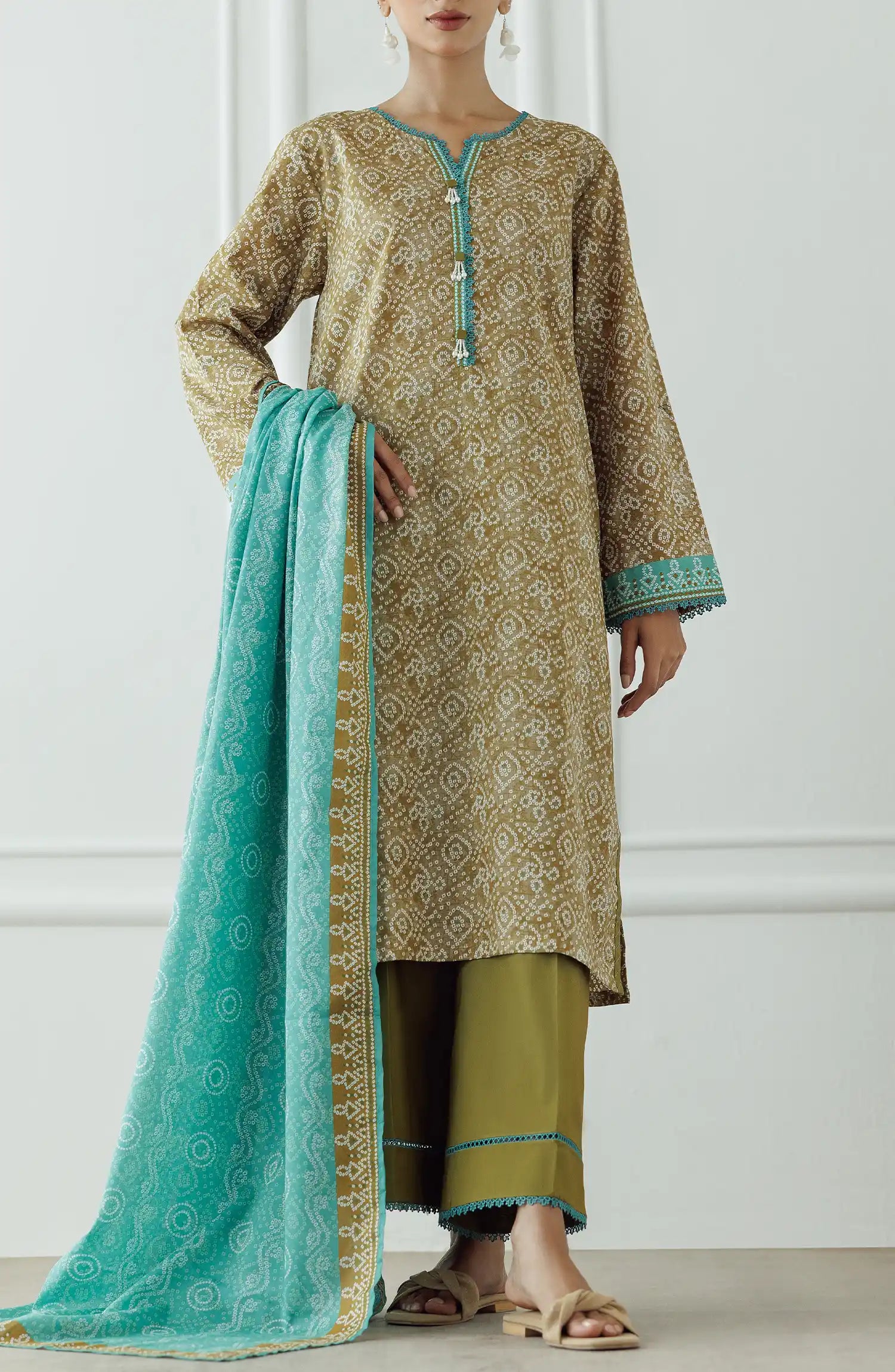 Woman wearing a patterned kurta with green dupatta against a dyed trouser. Stitched Printed Lawn Shirt Dupatta & Pant - 3 Piece Suits - OTL-25-408