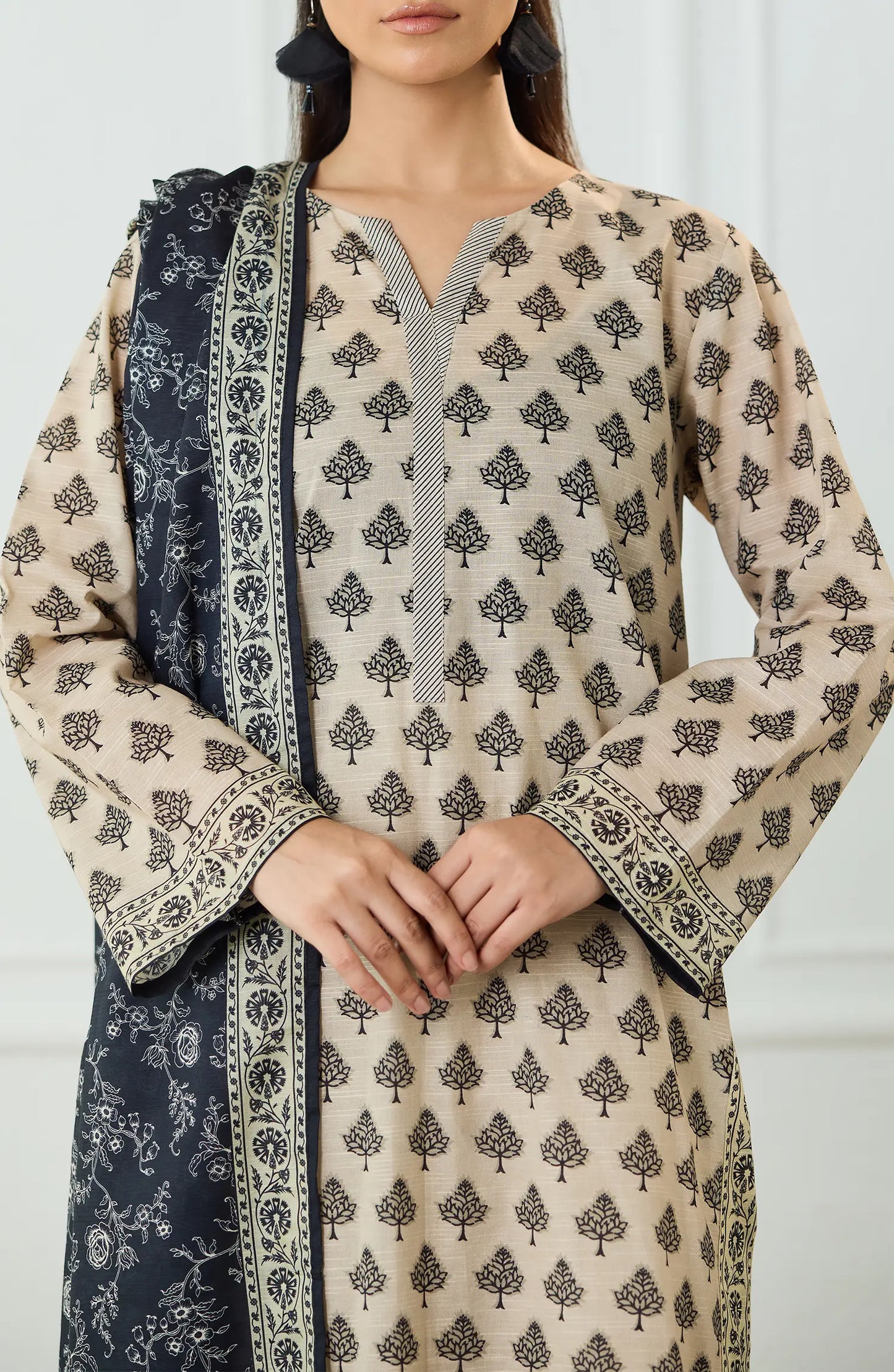 Woman wearing a patterned kurta with a matching dupatta on a dyed trouser. UNSTITCHED Printed Lawn Shirt Dupatta & Pant - 3 Piece Suits - OTL-25-461