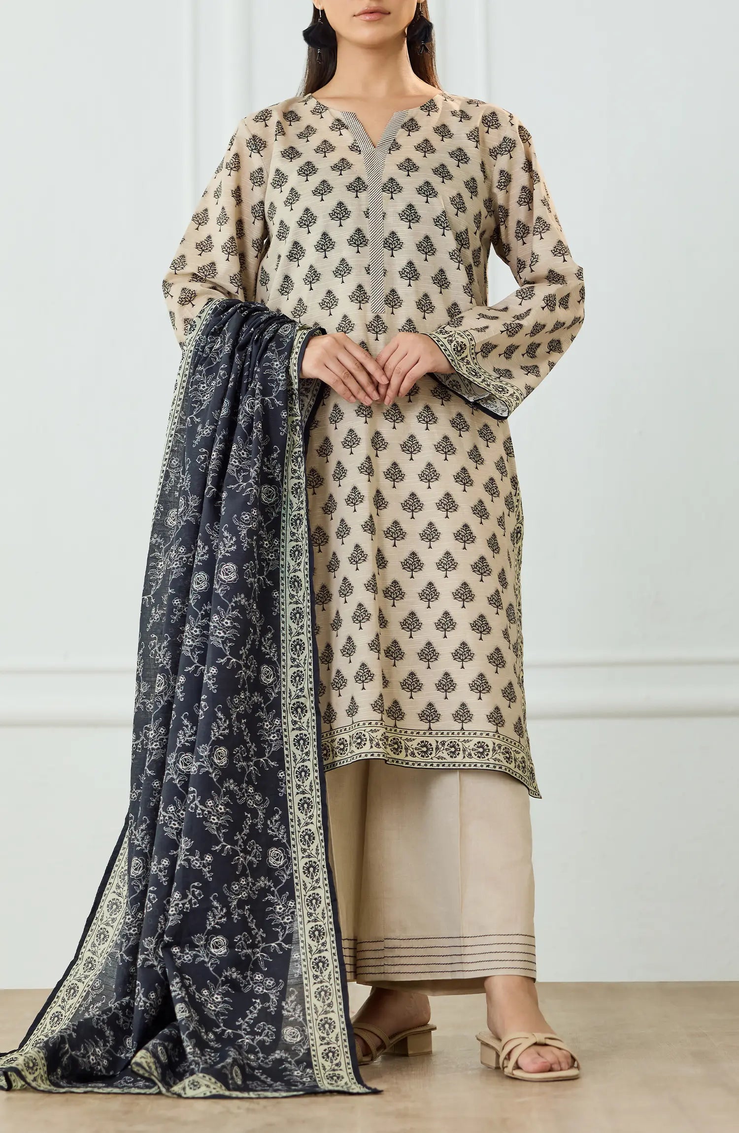 Woman wearing a patterned kurta with a matching dupatta on a dyed trouser. UNSTITCHED Printed Lawn Shirt Dupatta & Pant - 3 Piece Suits - OTL-25-461