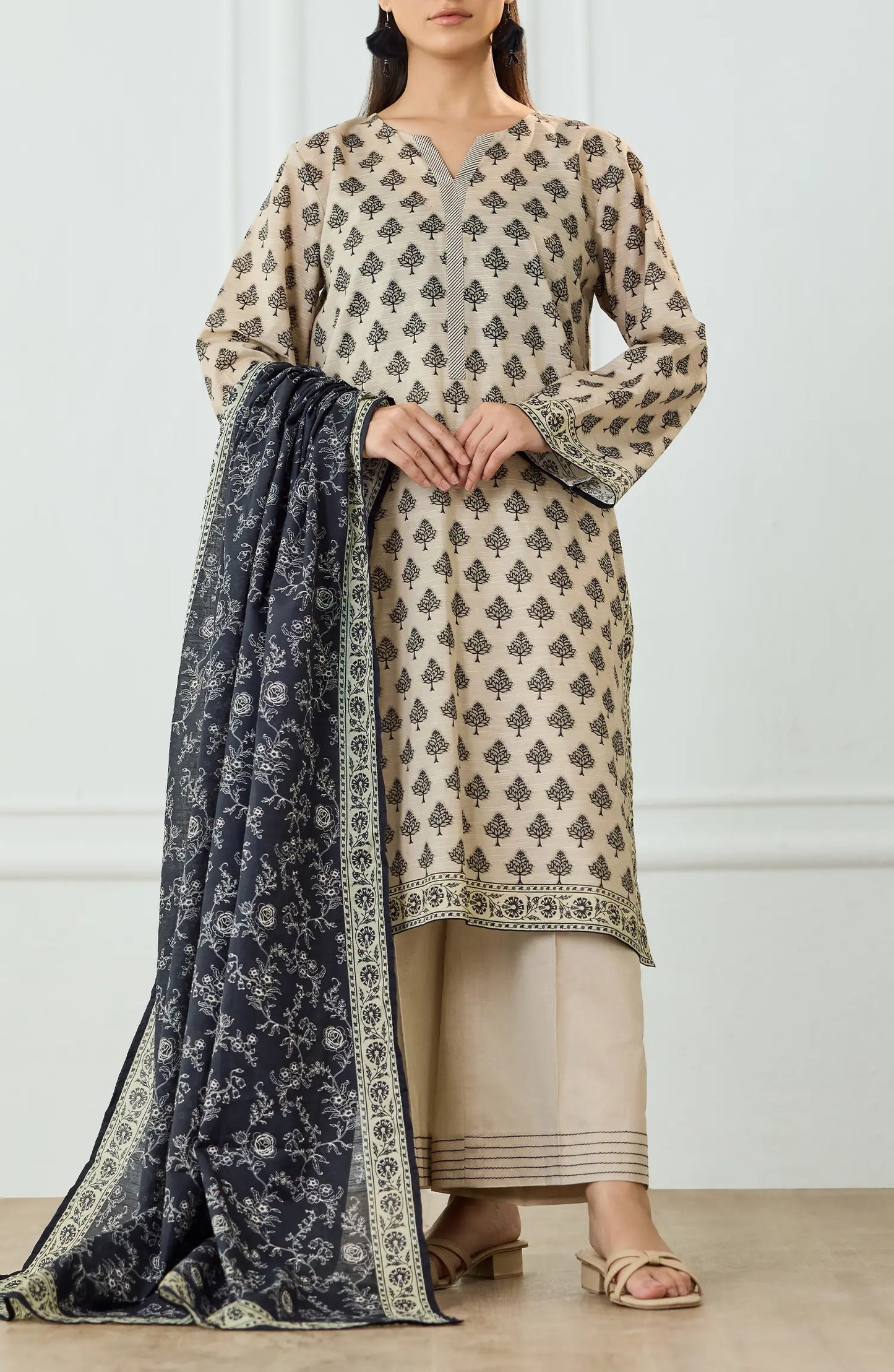 Woman wearing a patterned kurta with a matching dupatta on a dyed trouser. UNSTITCHED Printed Lawn Shirt Dupatta & Pant - 3 Piece Suits - OTL-25-461