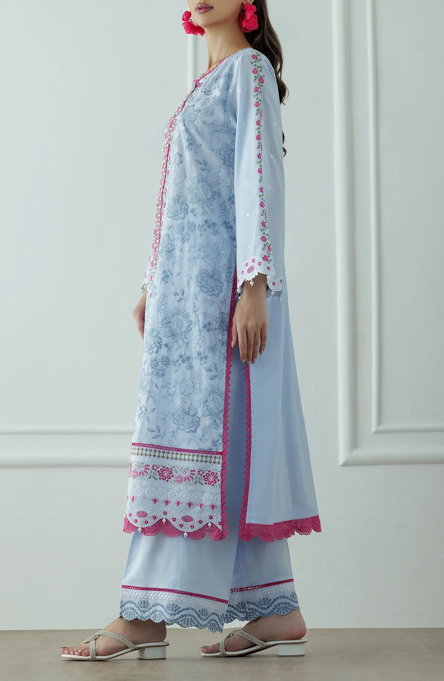 Woman wearing a light blue embroidered outfit with a floral dupatta against a dyed trouser. Stitched Luxury Premium Embroidered Lawn Shirt Dupatta & Pant - 3 Piece Suits - WRC25S-3008