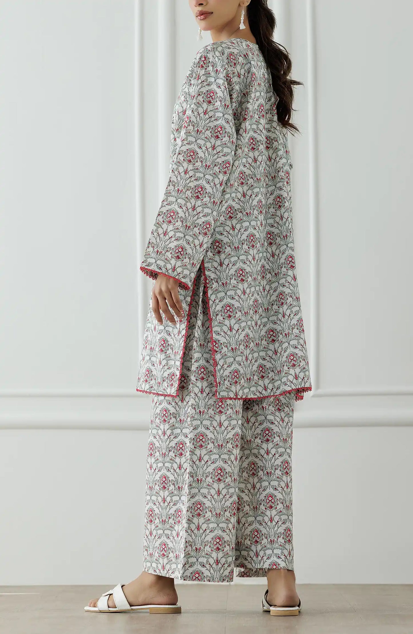 Woman wearing a floral dress with a printed trouser. Stitched Printed Lawn Shirt & Pant - 2 Piece Suits (Co-ord Set) - WRCC25S-2004