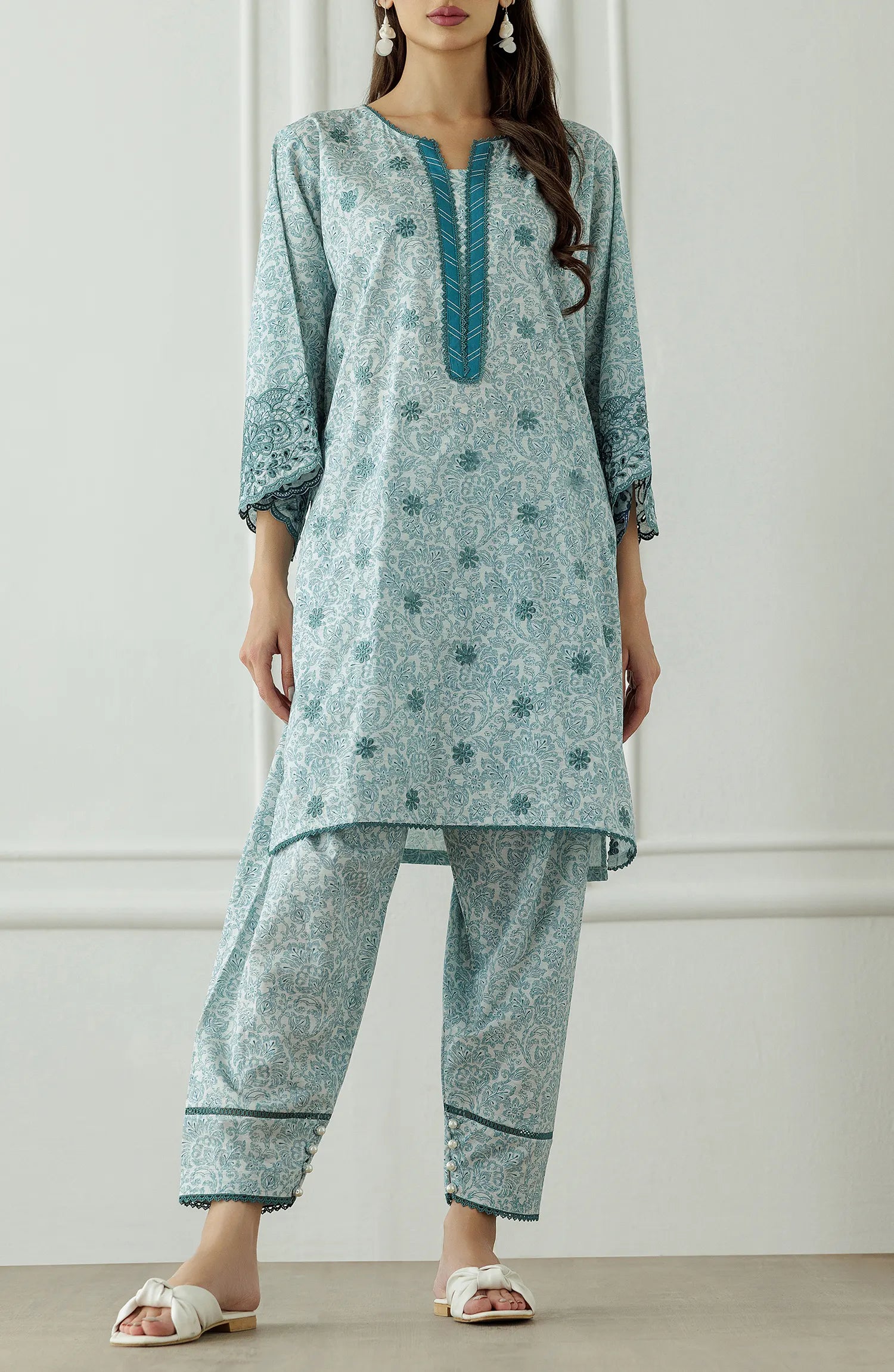 Woman wearing a light blue traditional outfit with floral patterns, Stitched Printed Lawn Shirt & Pant - 2 Piece Suits (Co-ord Set) - WRCC25S-2047