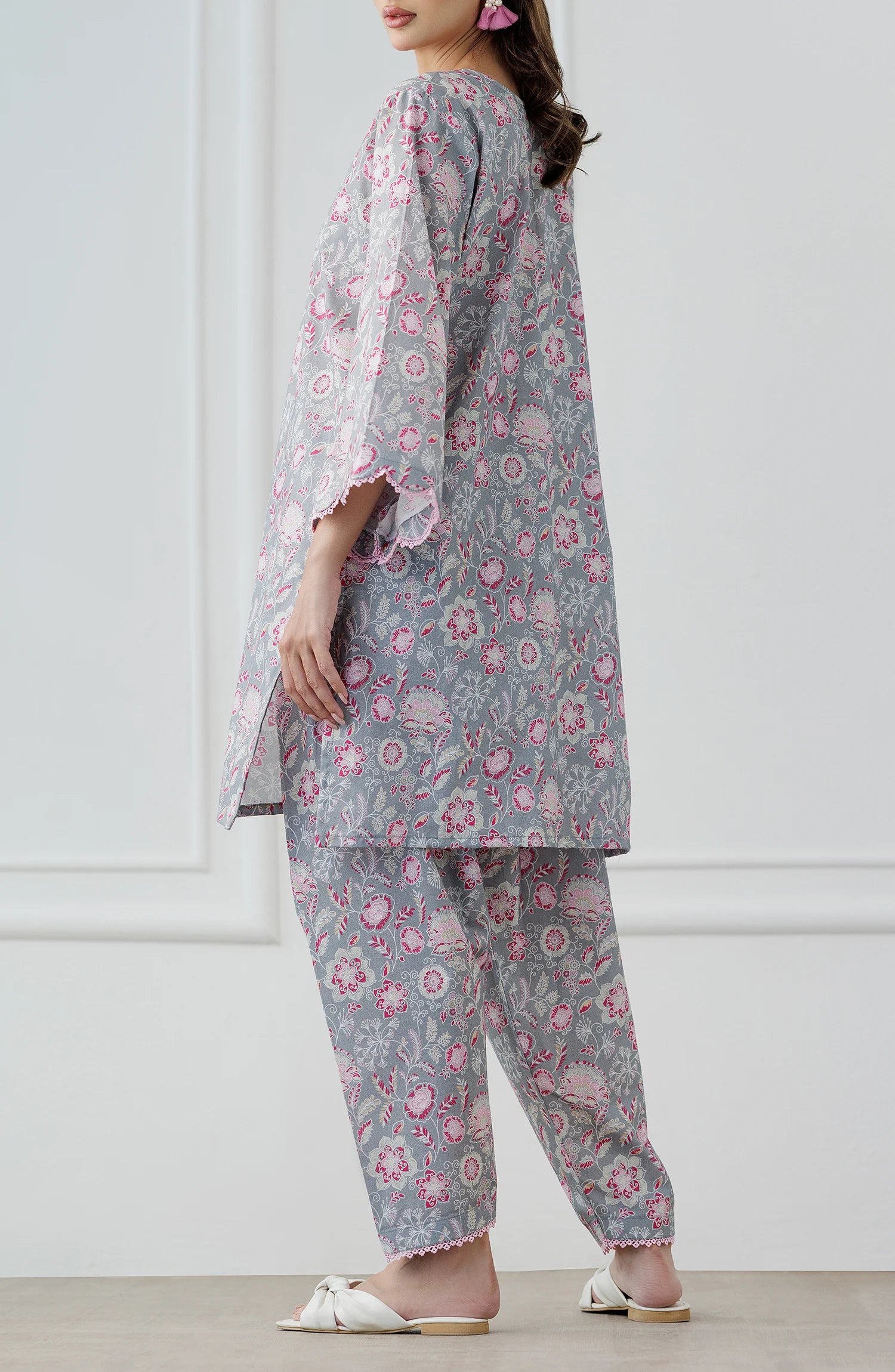 Woman wearing a floral outfit with a gray base shirt & trouser. Stitched Printed Lawn Shirt & Pant - 2 Piece Suits (Co-ord Set) - WRCV25S-2016