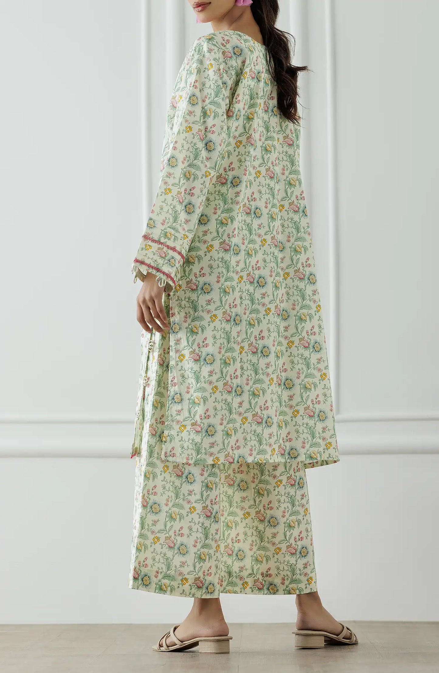 Woman wearing a floral dress with a matching paired trouser. Stitched Printed Lawn Shirt & Pant - 2 Piece Suits (Co-ord Set) - WRCV25S-2023