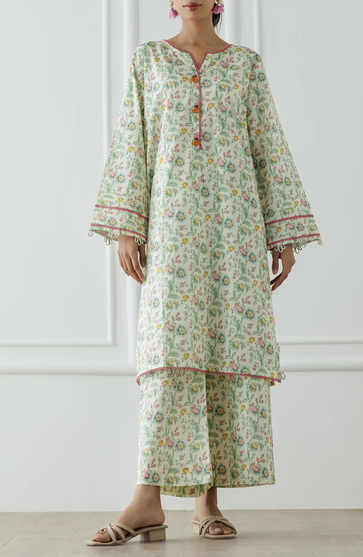 Woman wearing a floral dress with a matching paired trouser. Stitched Printed Lawn Shirt & Pant - 2 Piece Suits (Co-ord Set) - WRCV25S-2023
