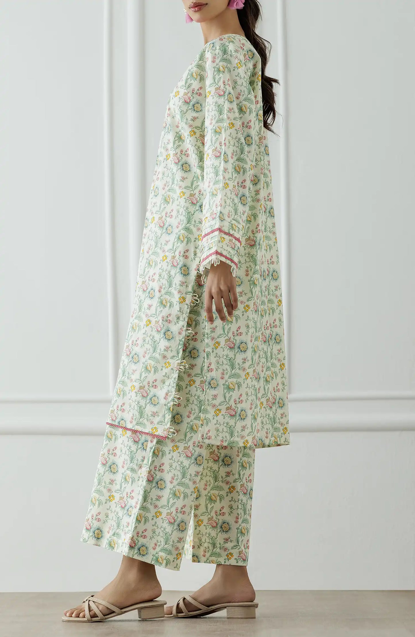 Woman wearing a floral dress with a matching paired trouser. Stitched Printed Lawn Shirt & Pant - 2 Piece Suits (Co-ord Set) - WRCV25S-2023