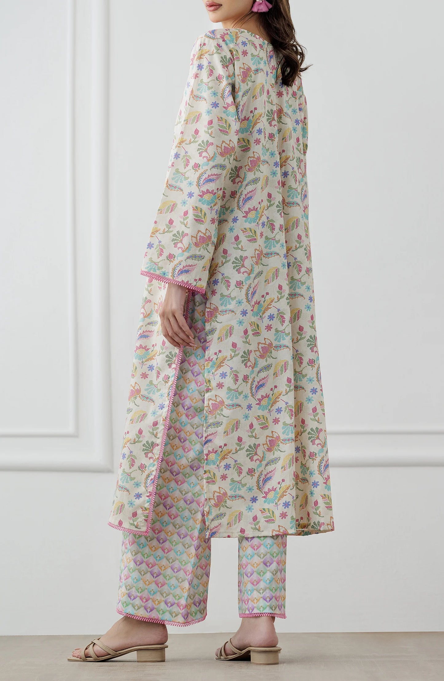 Woman wearing a floral kurta with matching pants. Stitched Printed Lawn Shirt & Pant - 2 Piece Suits (Co-ord Set) - WRCV25S-2024