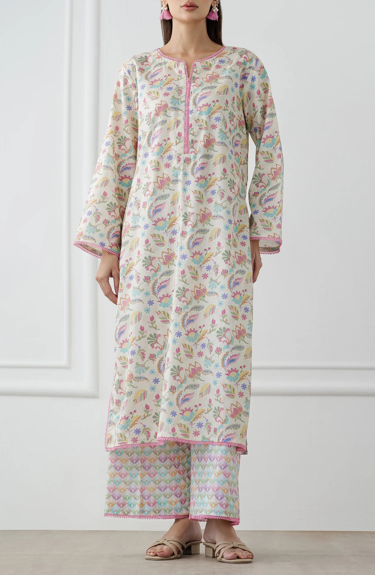 Woman wearing a floral kurta with matching pants. Stitched Printed Lawn Shirt & Pant - 2 Piece Suits (Co-ord Set) - WRCV25S-2024