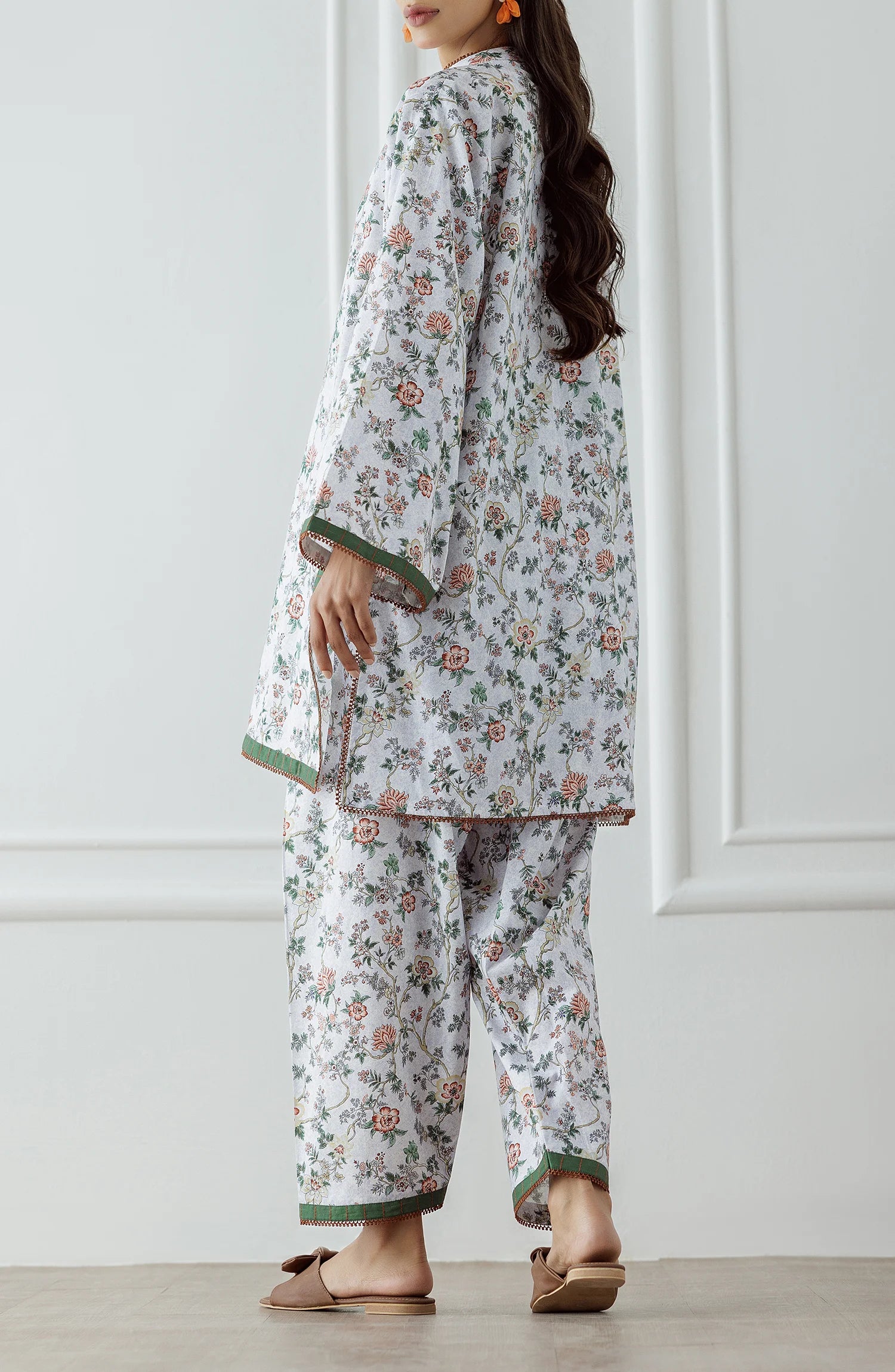 Woman wearing a floral white and beige outfit with a matching trouser. Stitched Printed Lawn Shirt & Pant - 2 Piece Suits (Co-ord Set) - WRCV25S-2029