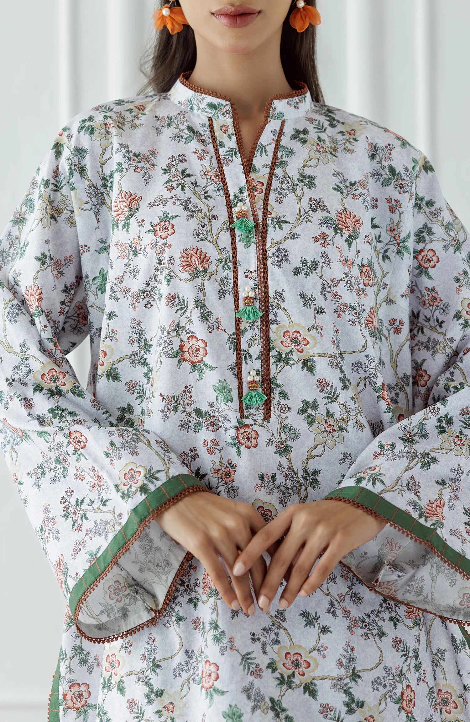 Woman wearing a floral white and beige outfit with a matching trouser. Stitched Printed Lawn Shirt & Pant - 2 Piece Suits (Co-ord Set) - WRCV25S-2029