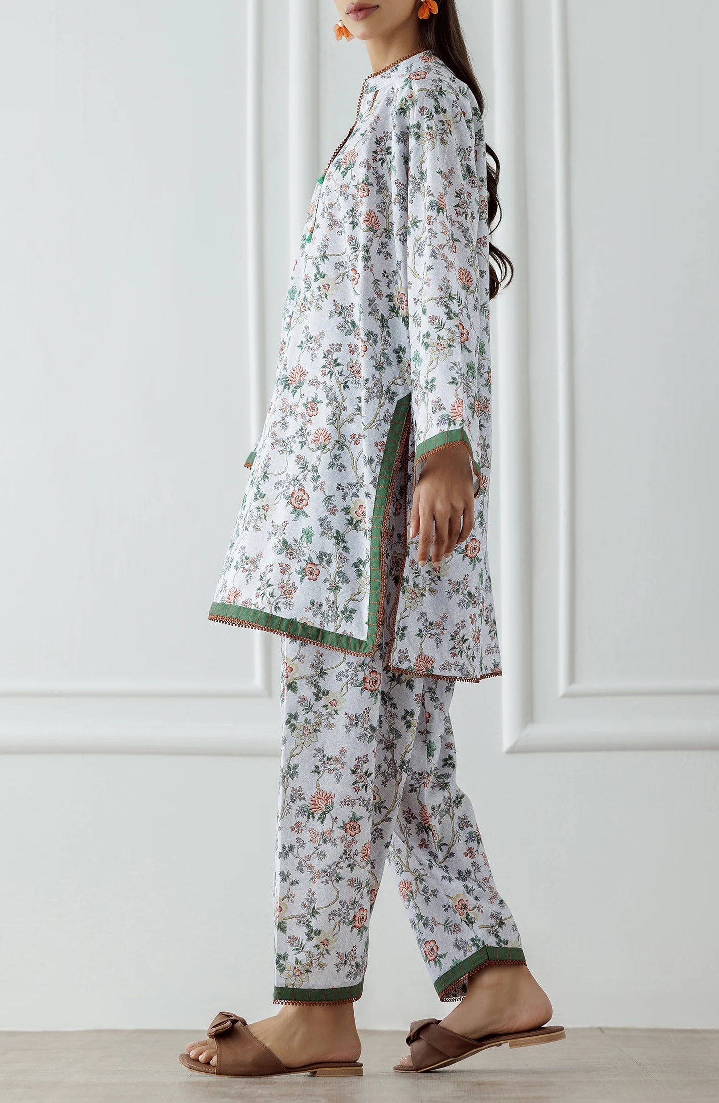 Woman wearing a floral white and beige outfit with a matching trouser. Stitched Printed Lawn Shirt & Pant - 2 Piece Suits (Co-ord Set) - WRCV25S-2029