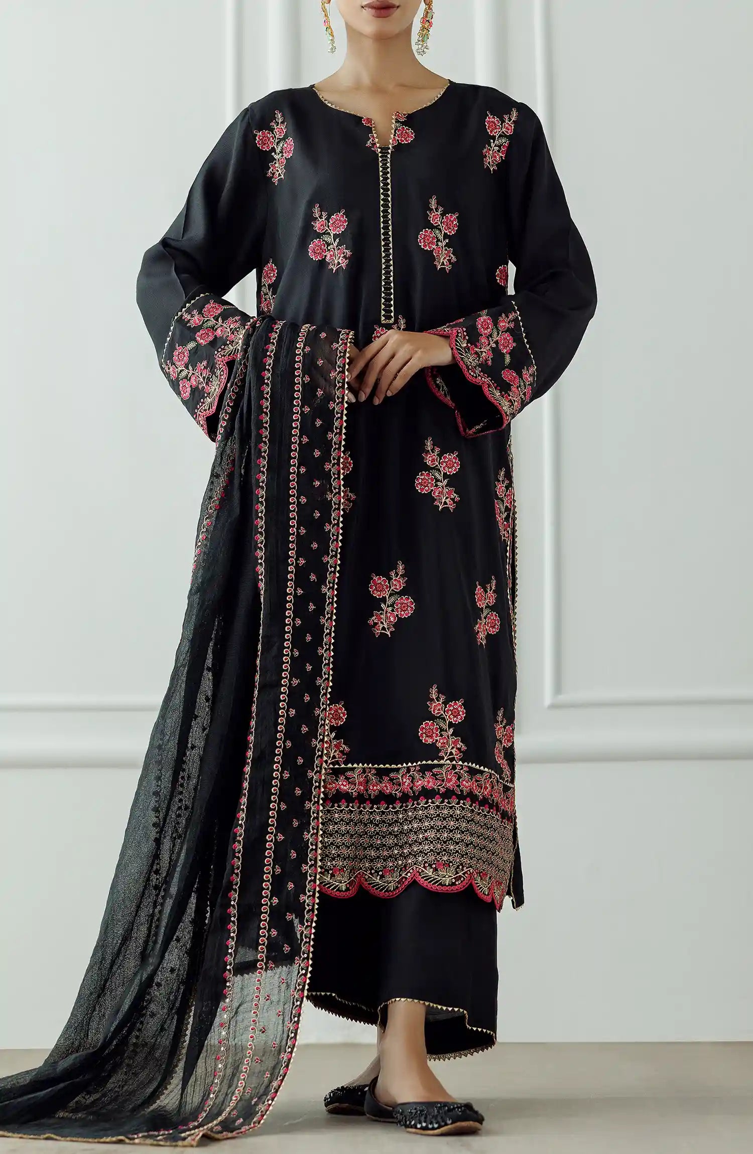 Women wearing a Black embroidered dress with pink floral patterns on a dyed trouser. Stitched Luxury Festive Formal Raw Silk Shirt Dupatta & Pant - 3 Piece Suits - WRFR24S-3017
