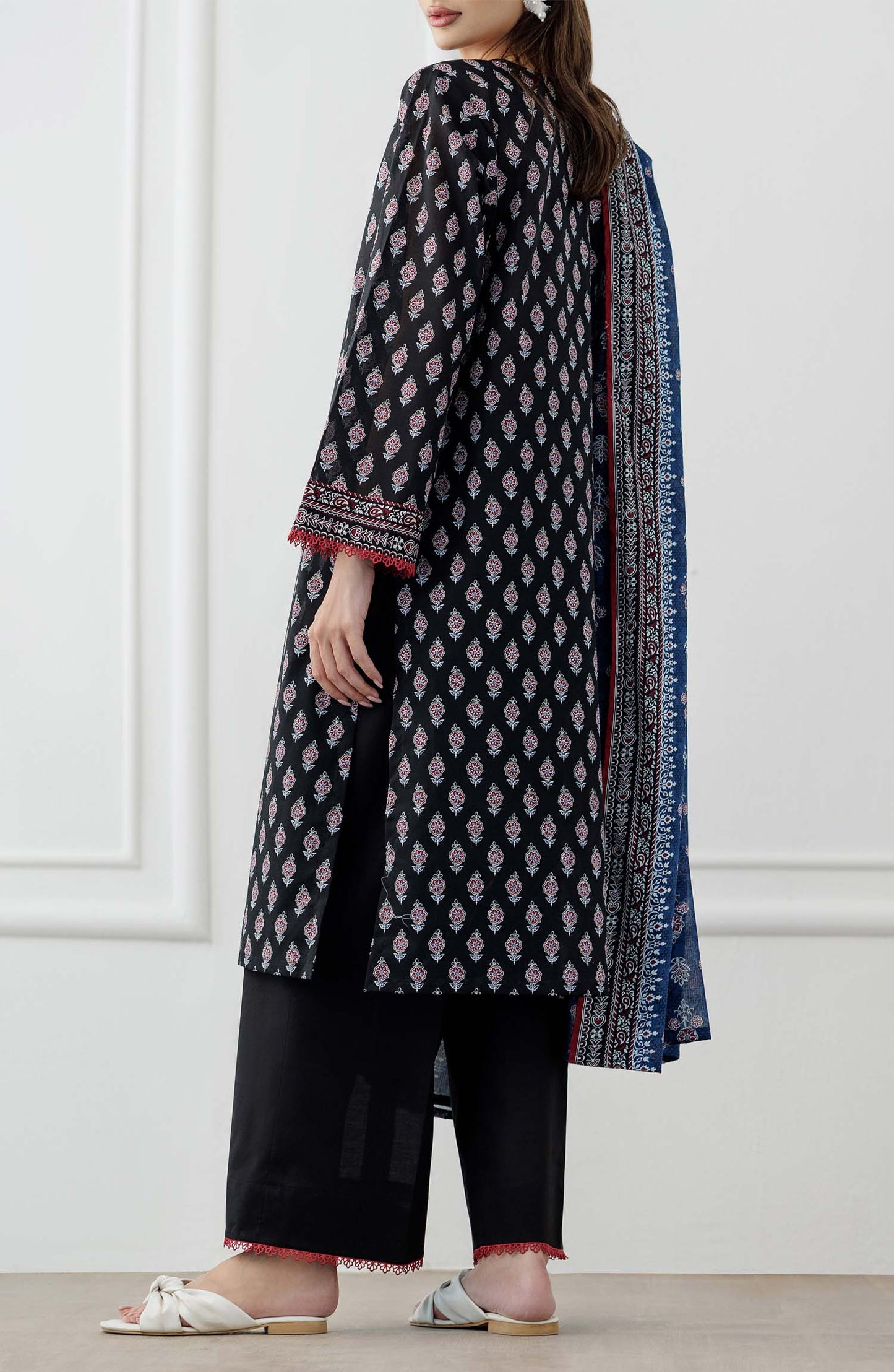 UNSTITCHED Printed Lawn Shirt Dupatta & Pant - 3 Piece Suits - OTL-25-048. Woman wearing a black and white patterned kurta with a blue printed dupatta against a plain trouser.