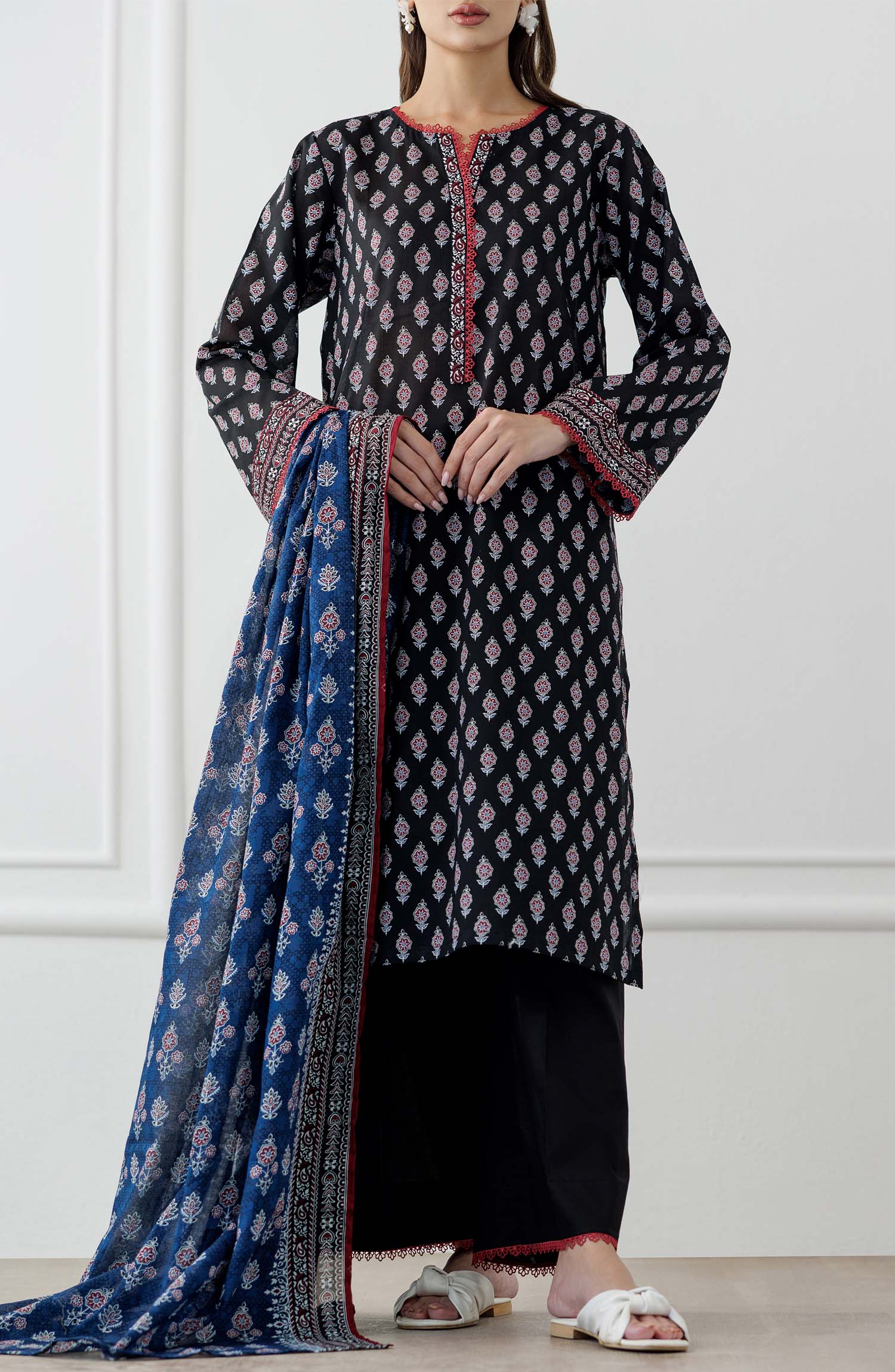UNSTITCHED Printed Lawn Shirt Dupatta & Pant - 3 Piece Suits - OTL-25-048. Woman wearing a black and white patterned kurta with a blue printed dupatta against a plain trouser.