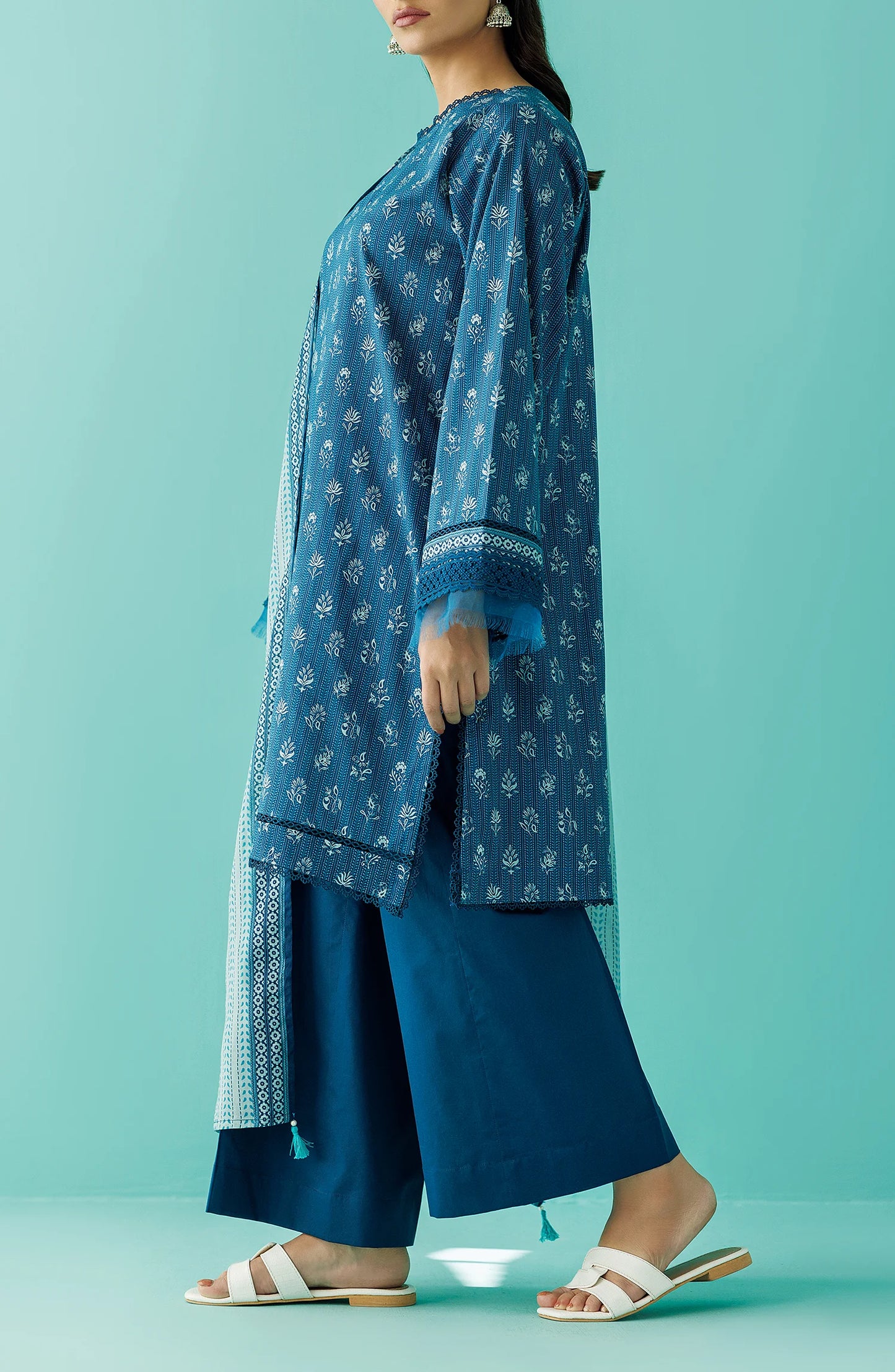 Woman wearing a blue traditional outfit with a matching dupatta against a teal blue shalwar. Unstitched Printed Lawn Shirt Dupatta & Pant - 3 Piece Suits - OTL-20045