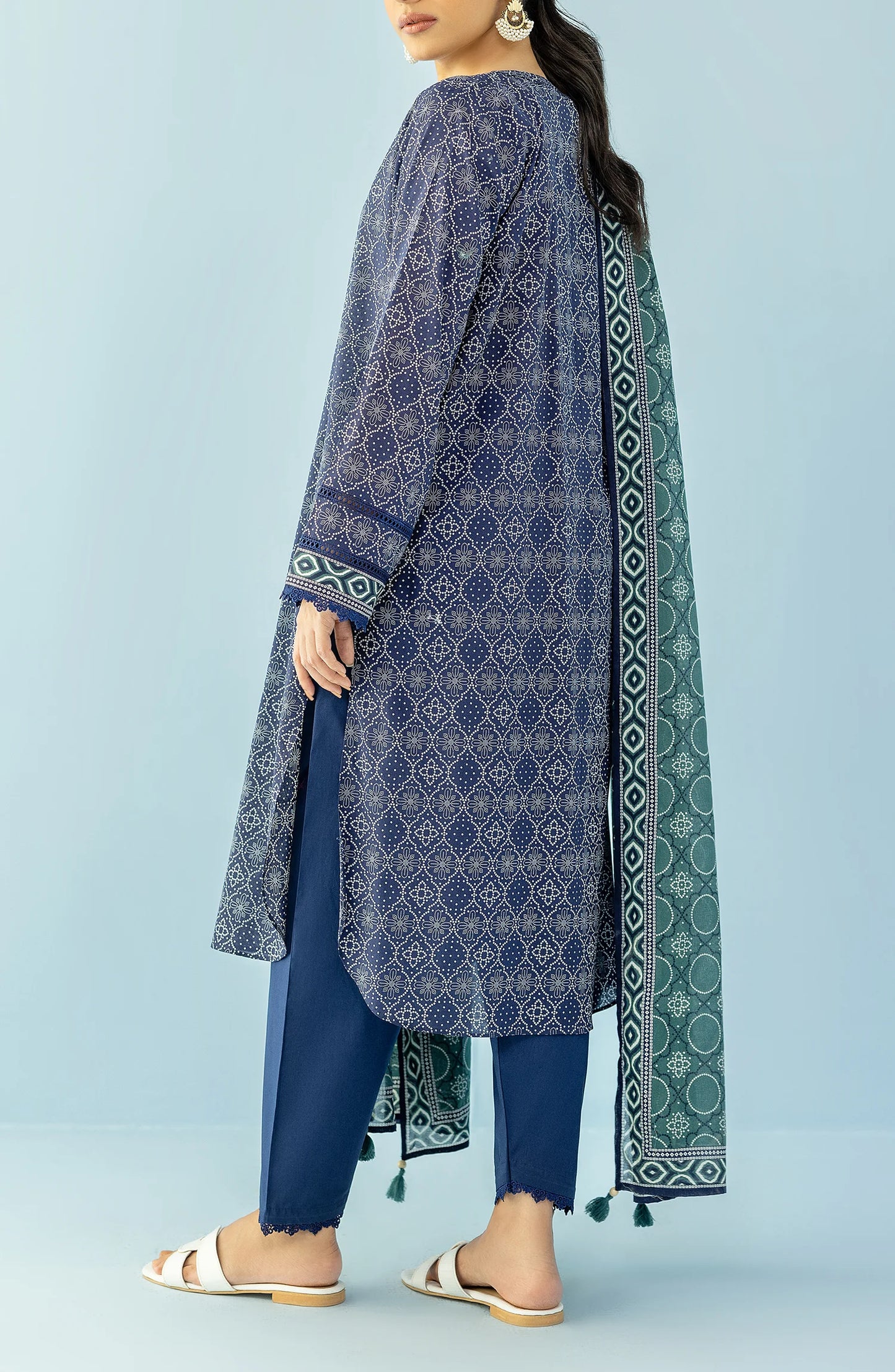 Woman wearing a navy blue patterned kurta with blue pants and a green dupatta on a blue trouser. Unstitched Printed Lawn Shirt Dupatta & Pant - 3 Piece Suits - OTL-20125