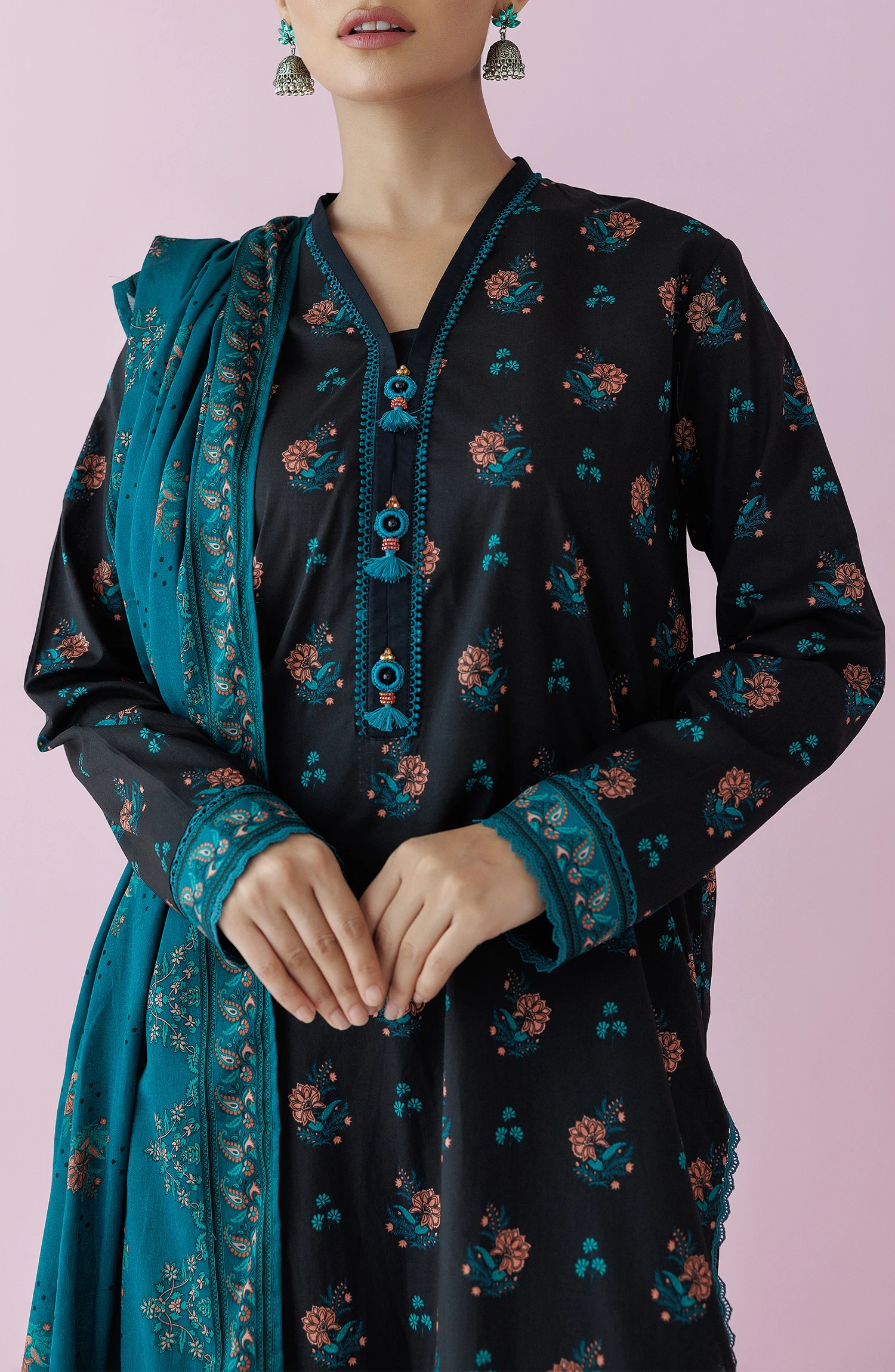 Woman wearing a black floral dress with a teal dupatta on a plain black trouser. Unstitched Printed Lawn Shirt Dupatta & Pant - 3 Piece Suits - OTL-20155