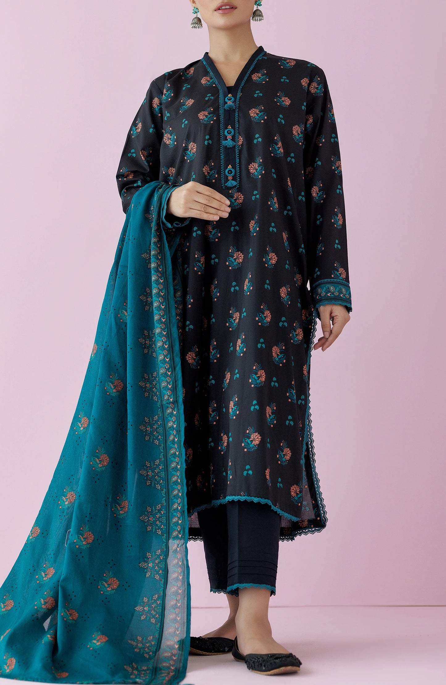 Woman wearing a black floral dress with a teal dupatta on a plain black trouser. Unstitched Printed Lawn Shirt Dupatta & Pant - 3 Piece Suits - OTL-20155