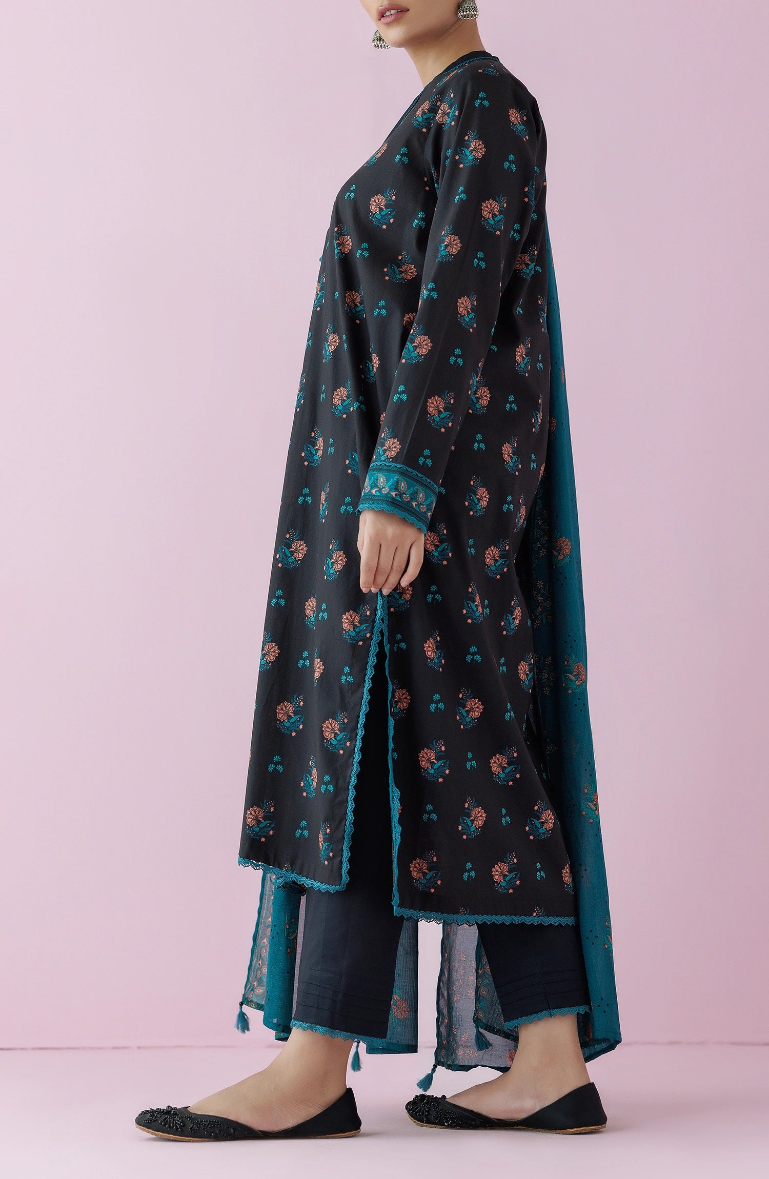 Woman wearing a black floral dress with a teal dupatta on a plain black trouser. Unstitched Printed Lawn Shirt Dupatta & Pant - 3 Piece Suits - OTL-20155