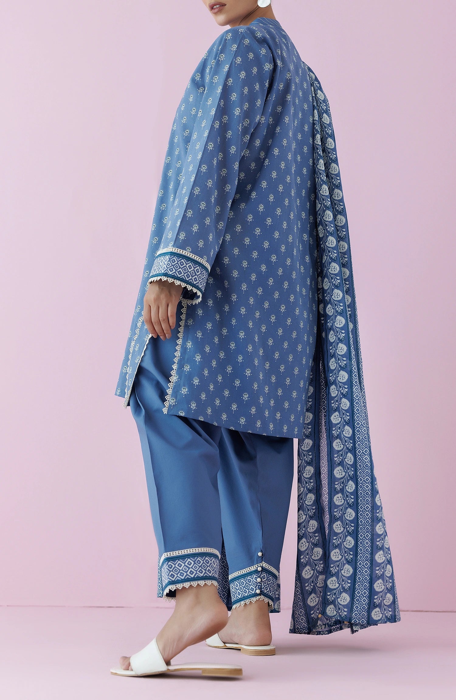 Woman wearing a blue traditional outfit with a matching dupatta on a dyed plain shalwar. Unstitched Printed Lawn Shirt Dupatta & Pant - 3 Piece Suits - OTL-20195