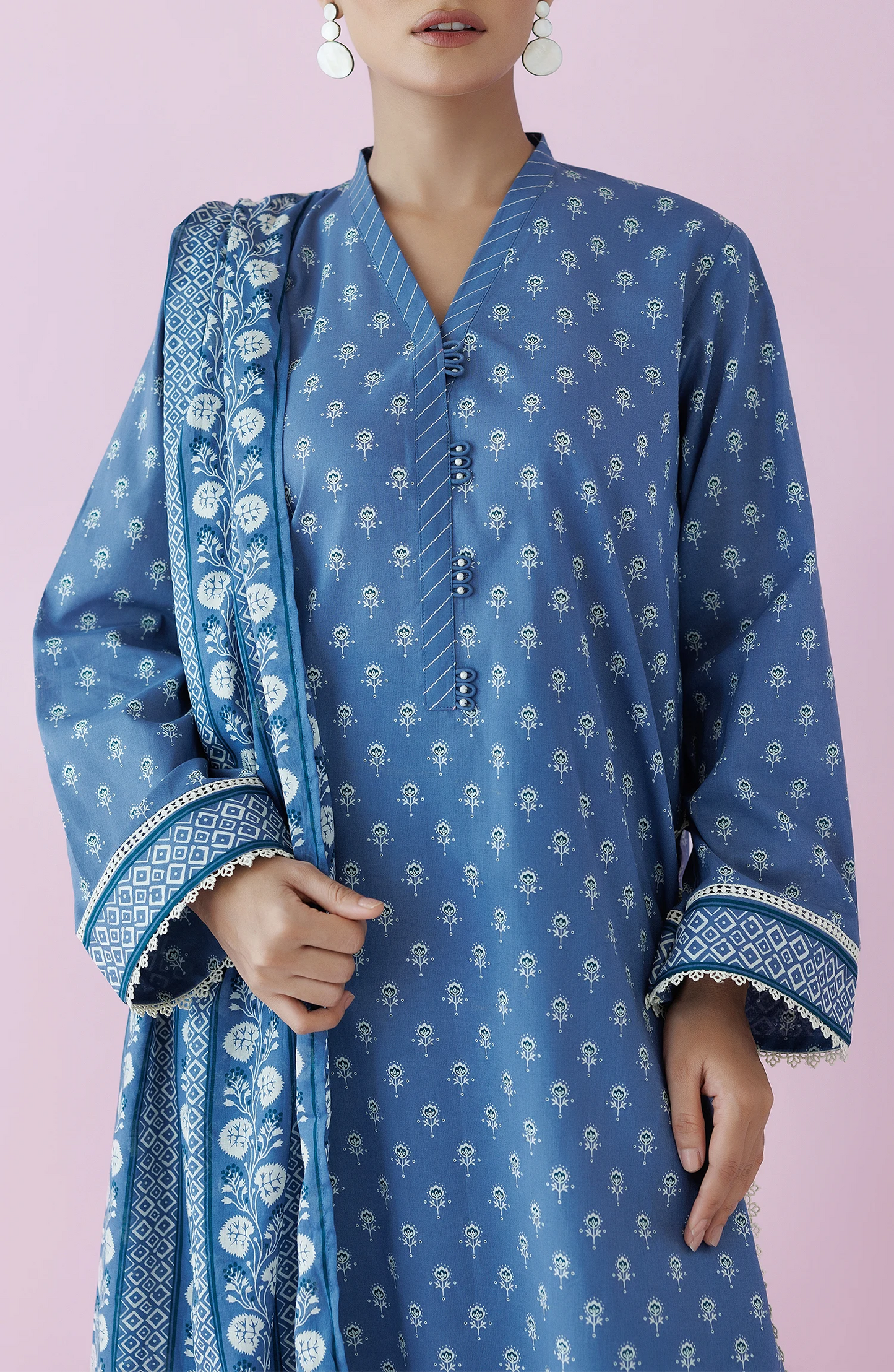 Woman wearing a blue traditional outfit with a matching dupatta on a dyed plain shalwar. Unstitched Printed Lawn Shirt Dupatta & Pant - 3 Piece Suits - OTL-20195