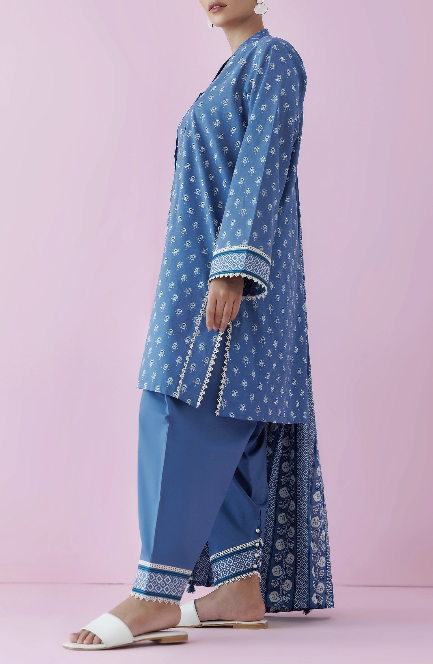 Woman wearing a blue traditional outfit with a matching dupatta on a dyed plain shalwar. Unstitched Printed Lawn Shirt Dupatta & Pant - 3 Piece Suits - OTL-20195