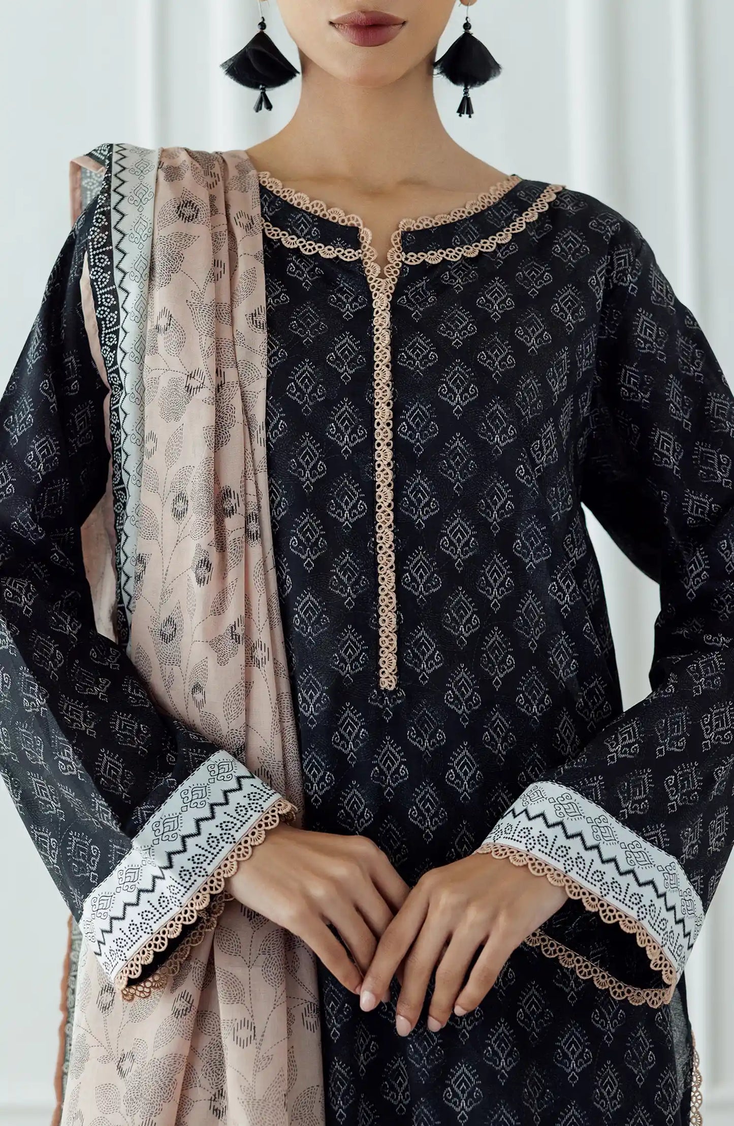 STITCHED Printed Lawn Shirt Dupatta & Pant - 3 Piece - OTL-25-023. Woman wearing a black patterned kurta with a matching dupatta plain black shalwar.