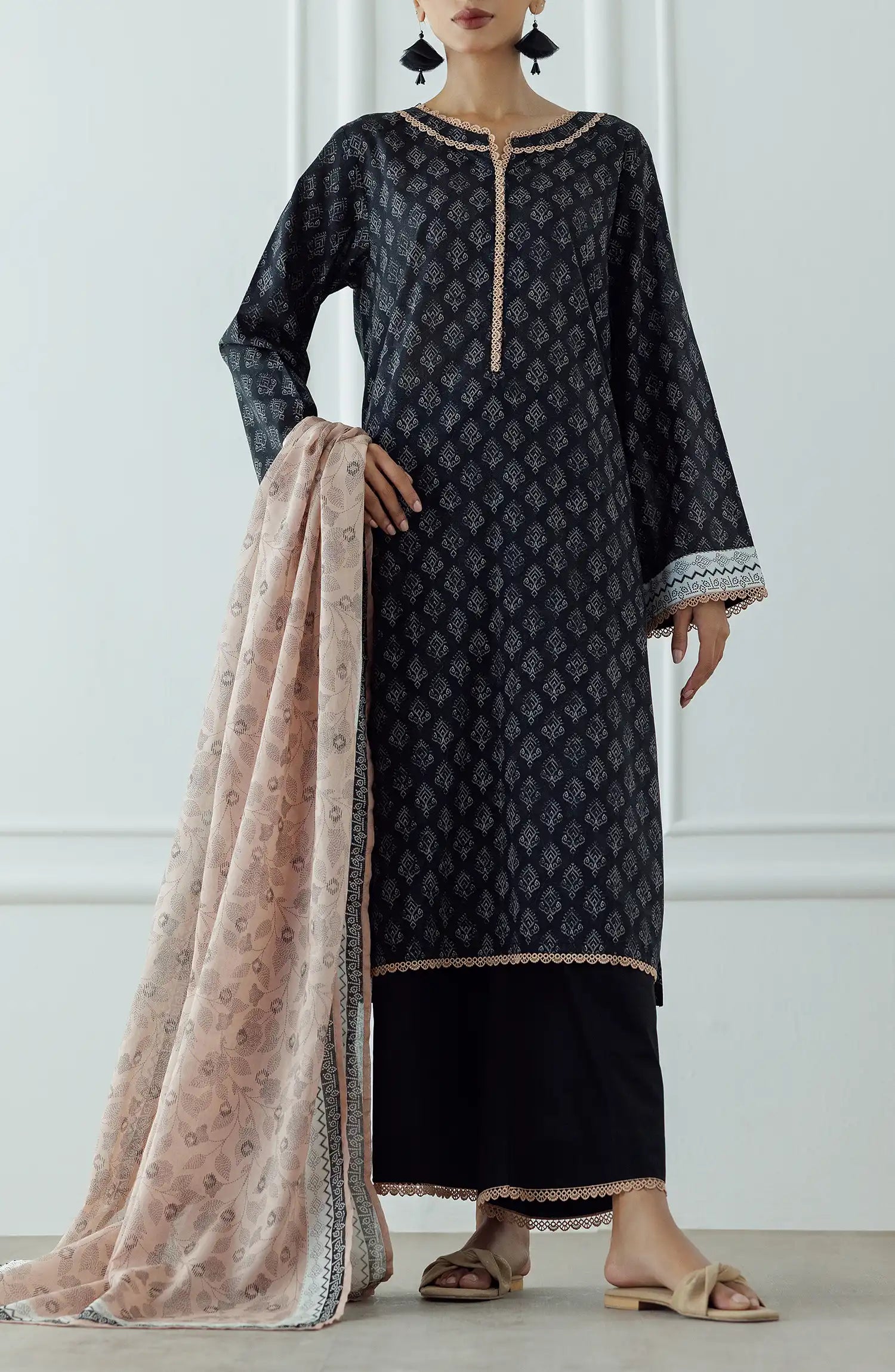 STITCHED Printed Lawn Shirt Dupatta & Pant - 3 Piece - OTL-25-023. Woman wearing a black patterned kurta with a matching dupatta plain black shalwar.