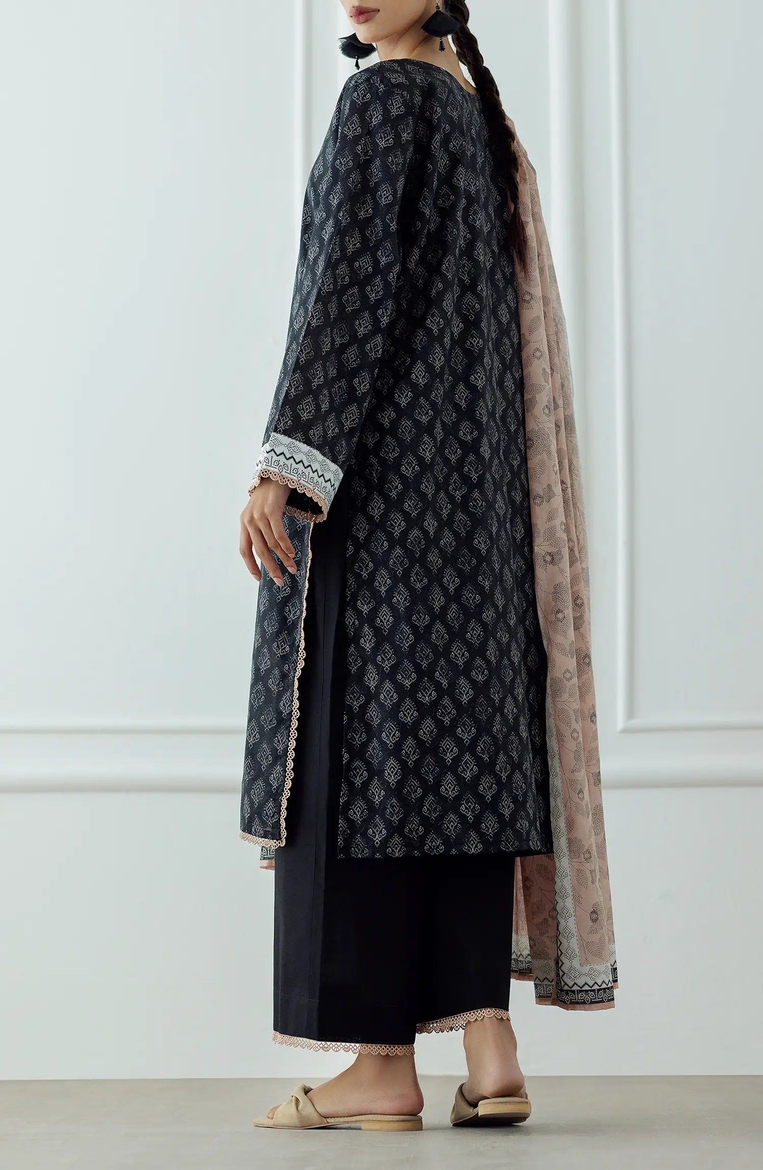 STITCHED Printed Lawn Shirt Dupatta & Pant - 3 Piece - OTL-25-023. Woman wearing a black patterned kurta with a matching dupatta plain black shalwar.