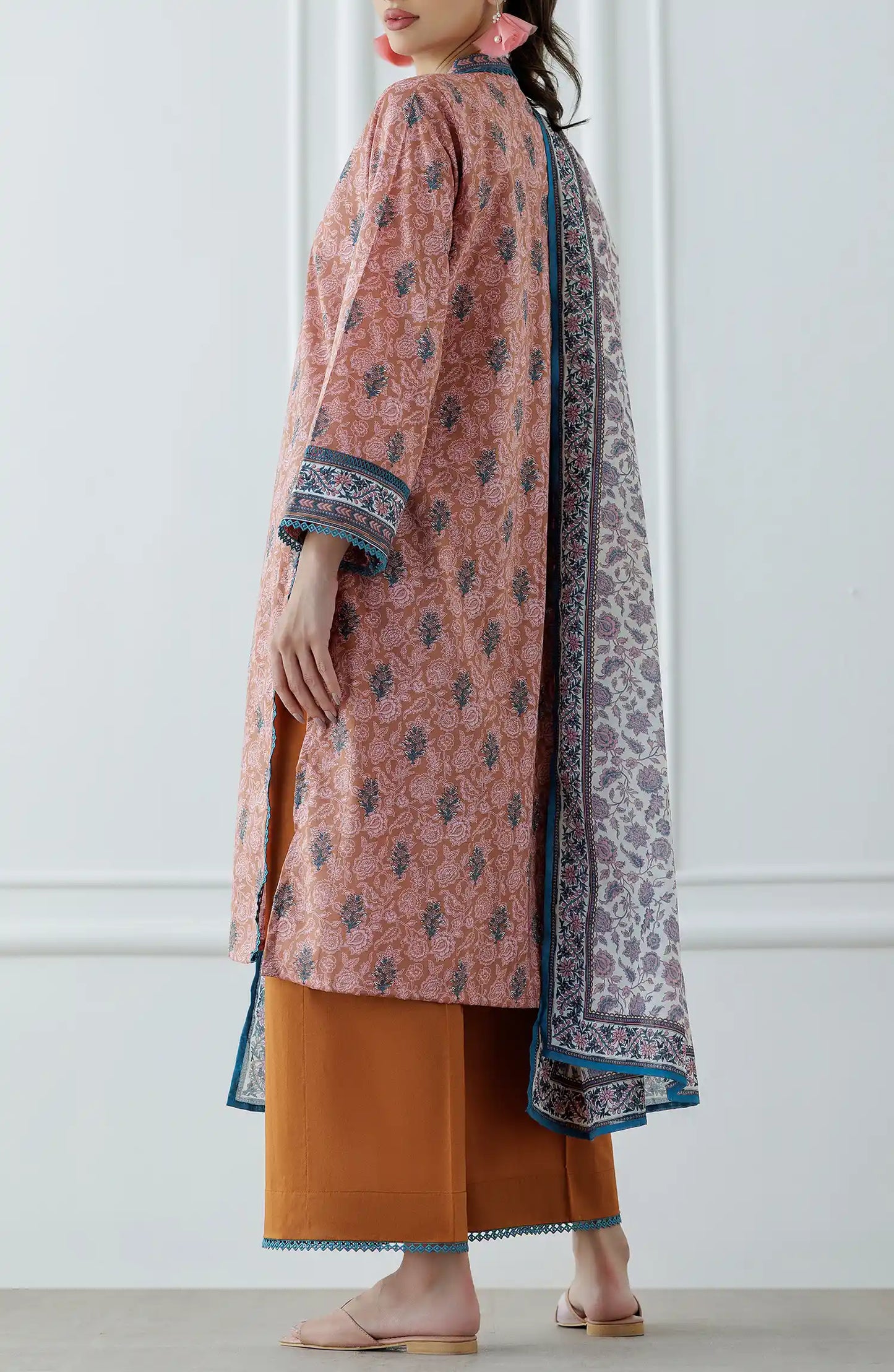 Woman wearing a pink and orange traditional outfit with a patterned dupatta on a plain trouser. Stitched Printed Lawn Shirt Dupatta & Pant - 3 Piece Suits - OTL-25-027